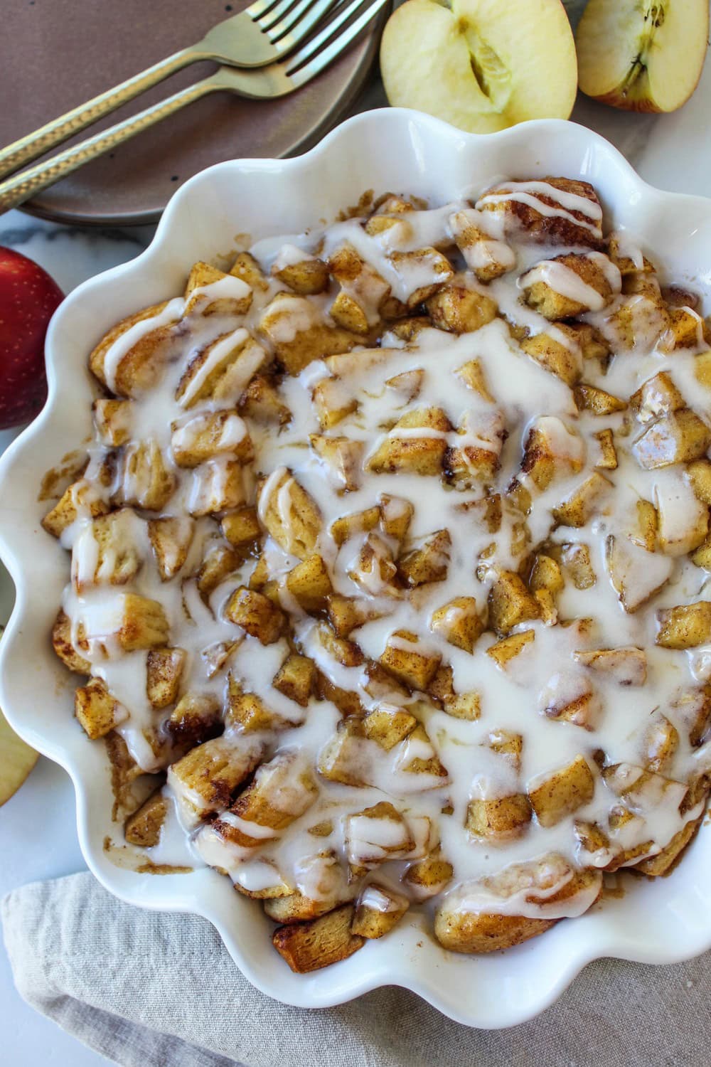 Apple fritter cinnamon roll bake in a baking dish