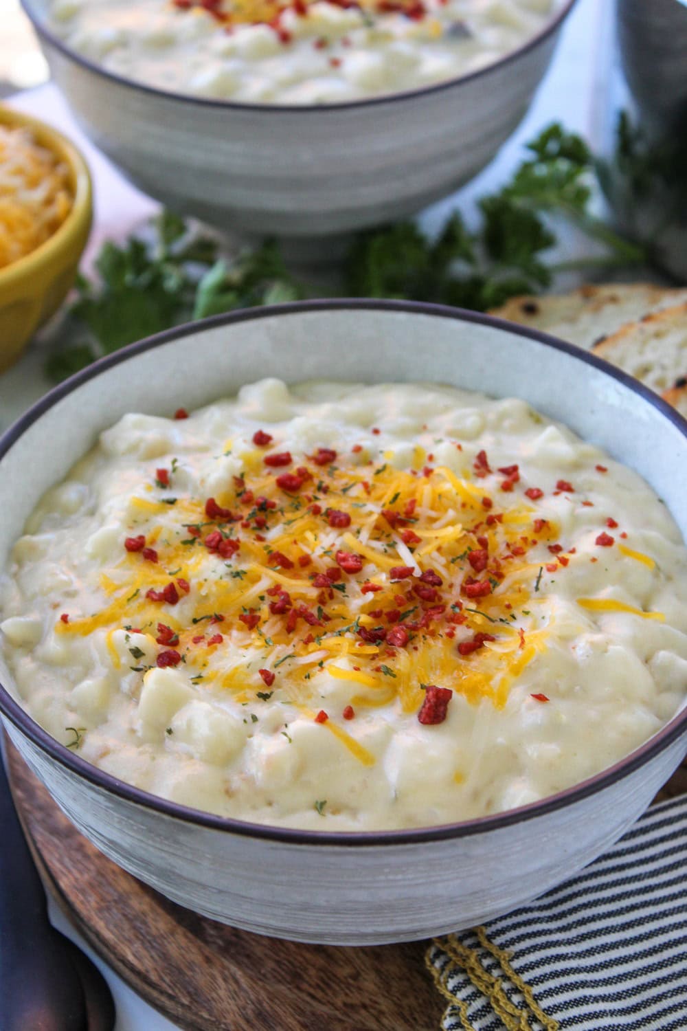 Close‑up of creamy cheesy potato soup showing tender potato chunks