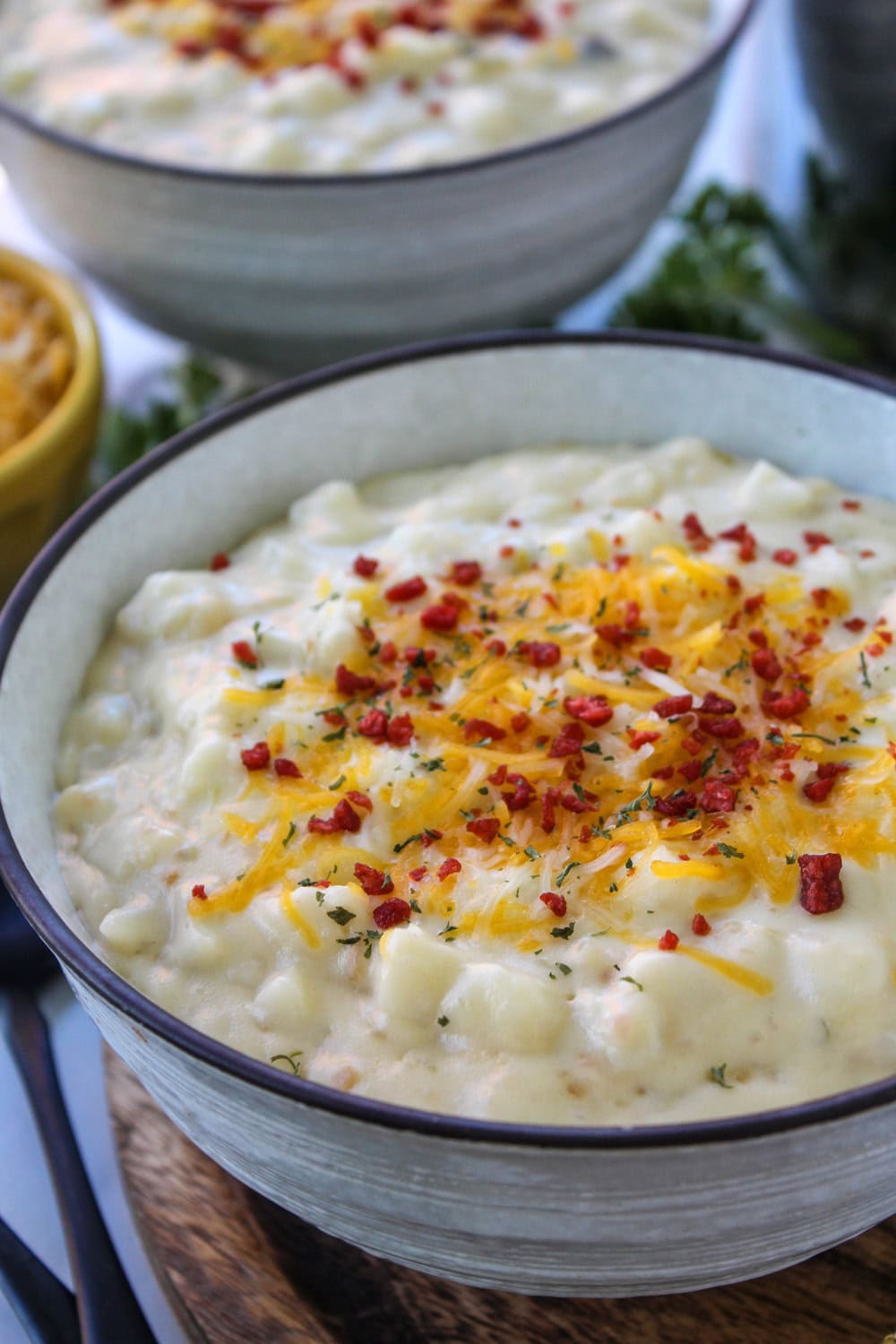 Thick cheesy potato soup showing creamy texture and diced potatoes