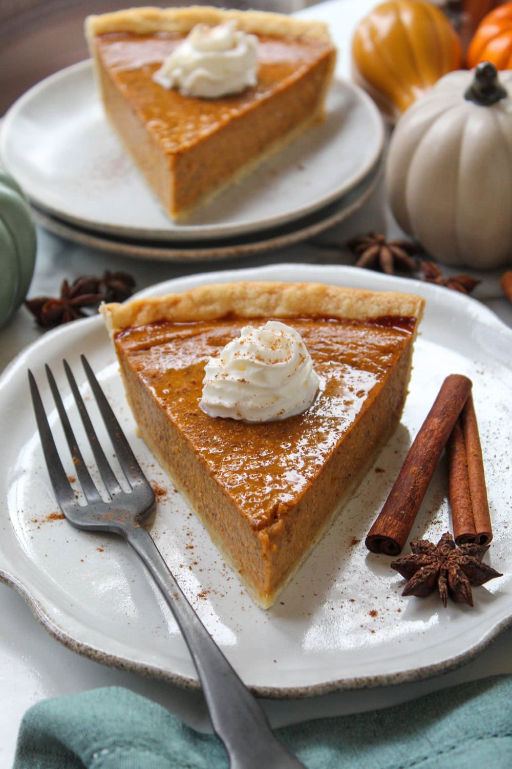 Slice of no‑fail pumpkin pie showing silky texture and warm fall spices
