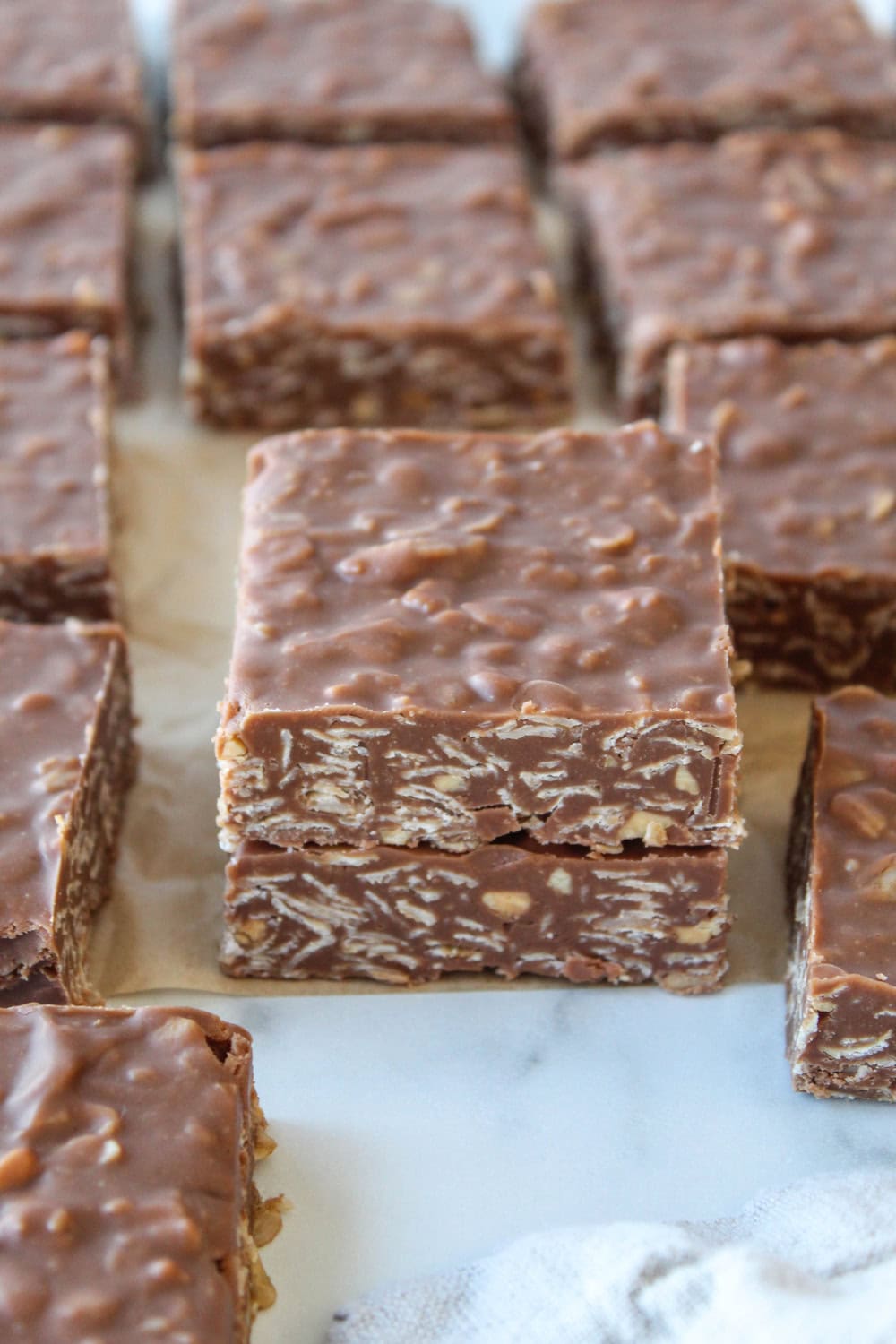 Homemade no‑bake chocolate peanut butter oat bars made with oats and chocolate
