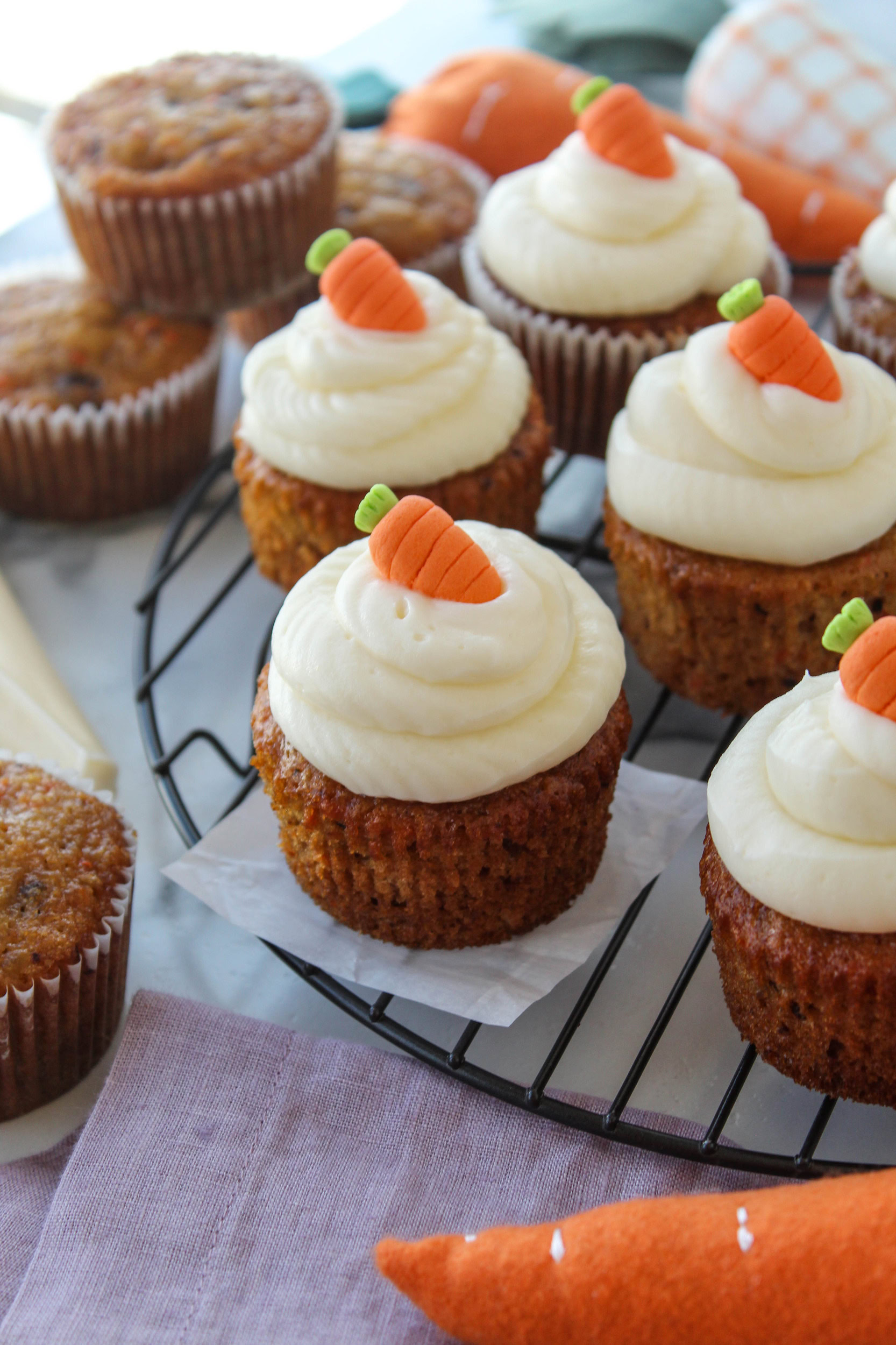 Moist carrot cake cupcakes topped with creamy cream cheese frosting