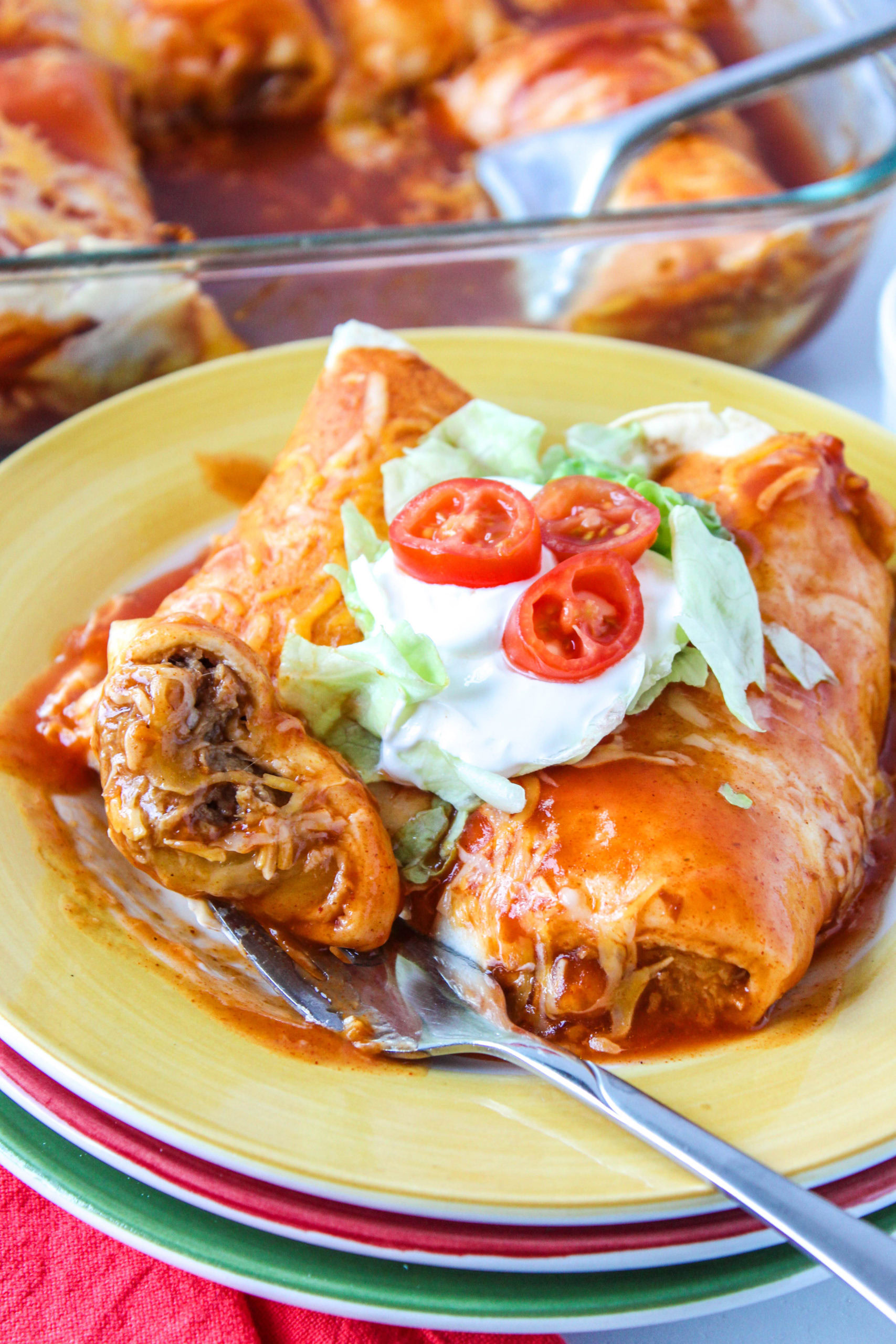 Freshly baked vegetarian enchiladas with red sauce