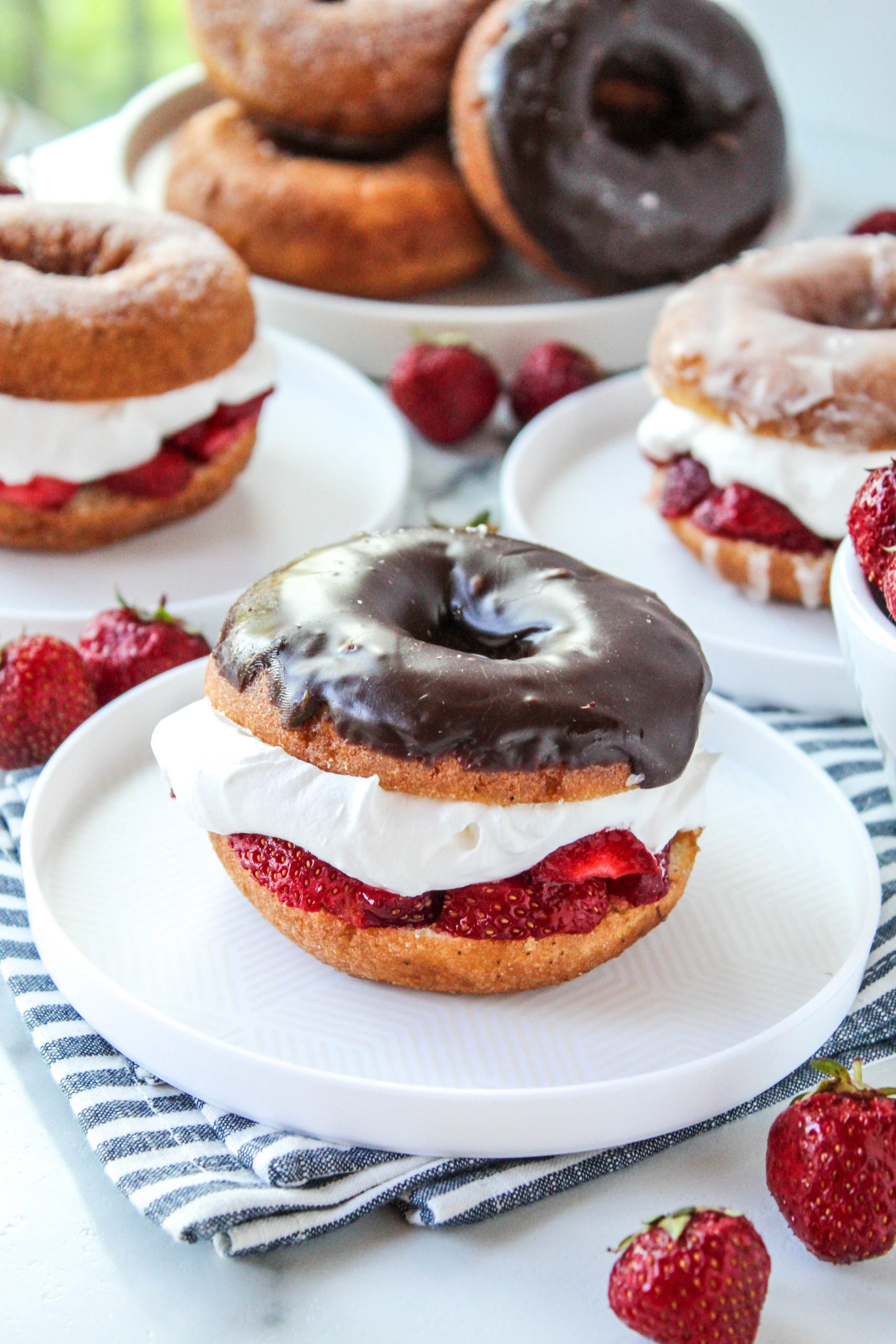 strawberry shortcake made with glazed donuts on plate