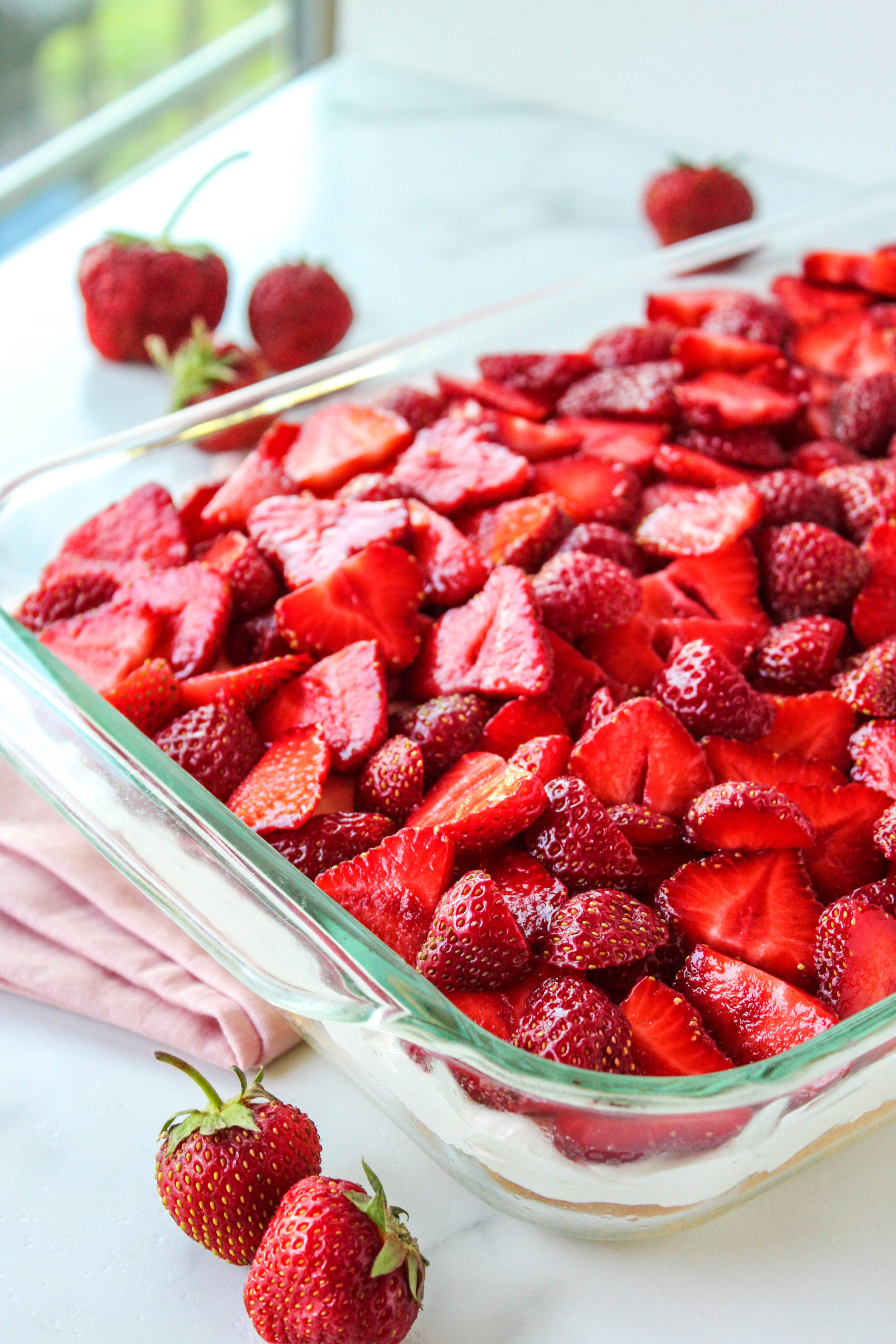 Close-up of strawberry shortcake dessert bars with fresh sliced strawberries