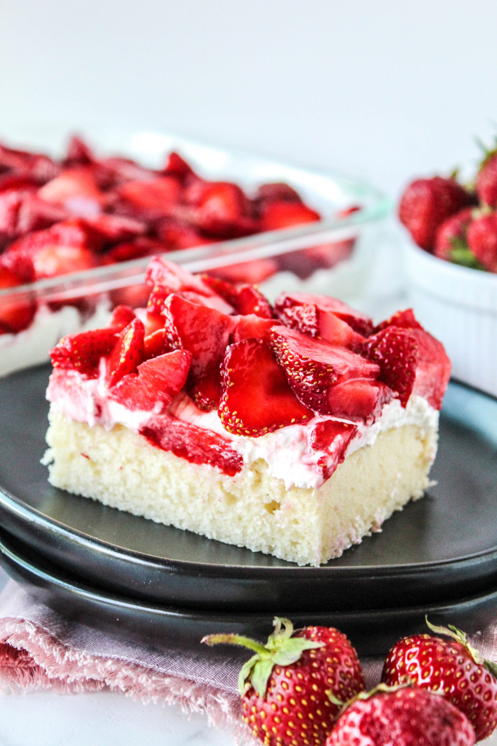 Easy strawberry shortcake bars with fresh strawberries and creamy layer