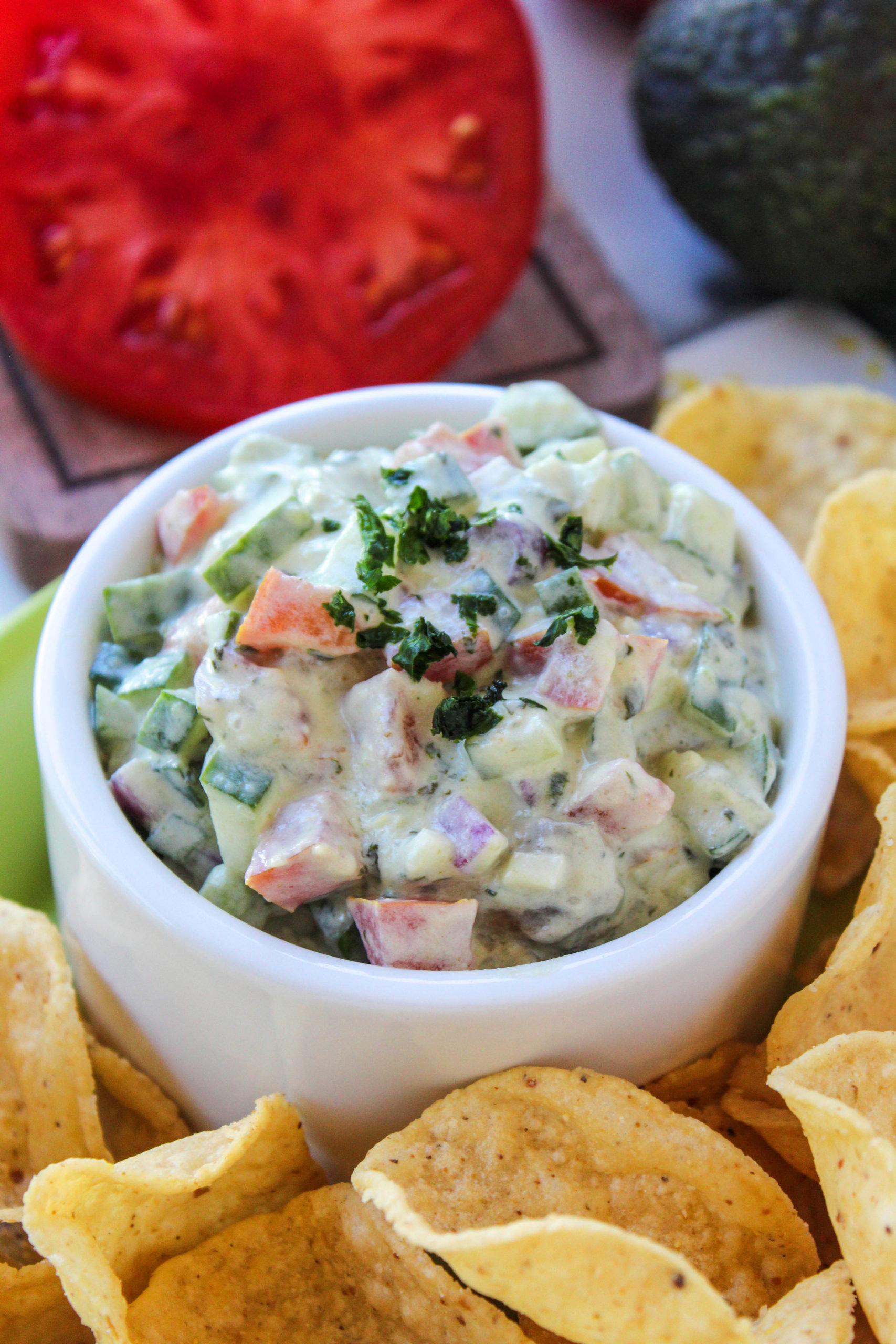 Fresh cucumber avocado salsa made with diced cucumber, avocado, tomato, and herbs