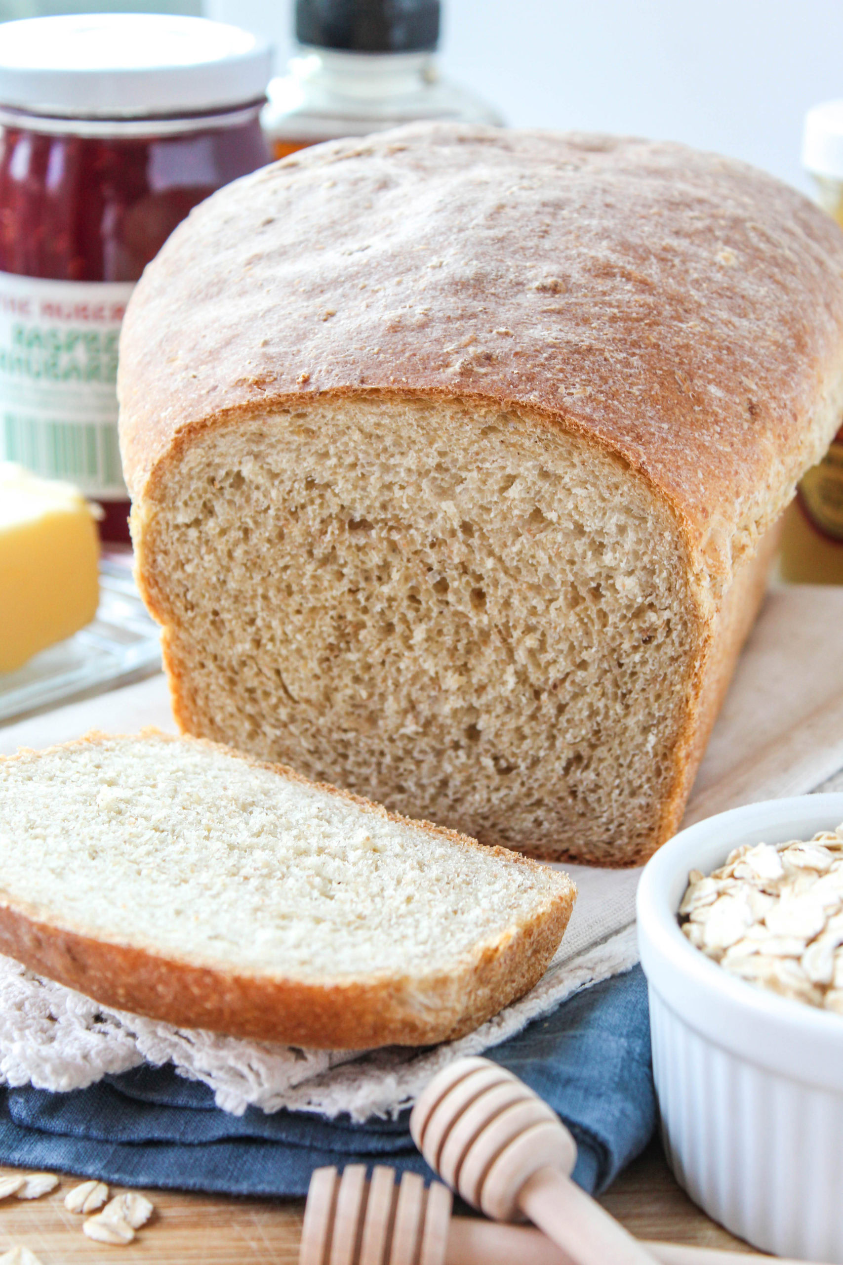 Soft homemade oatmeal bread sliced to show a moist, tender crumb