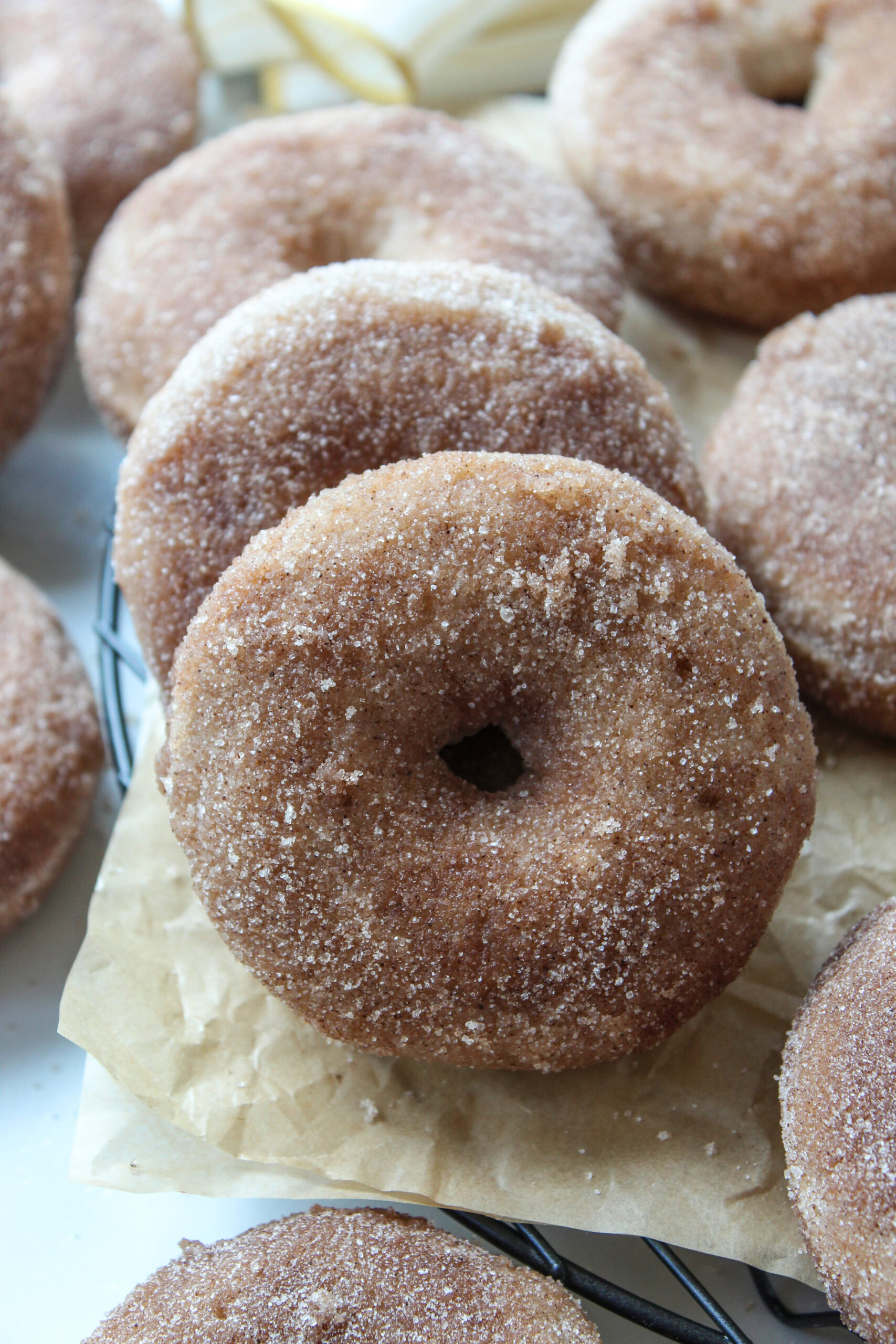 Close‑up of baked cinnamon sugar donuts showing their soft, fluffy texture