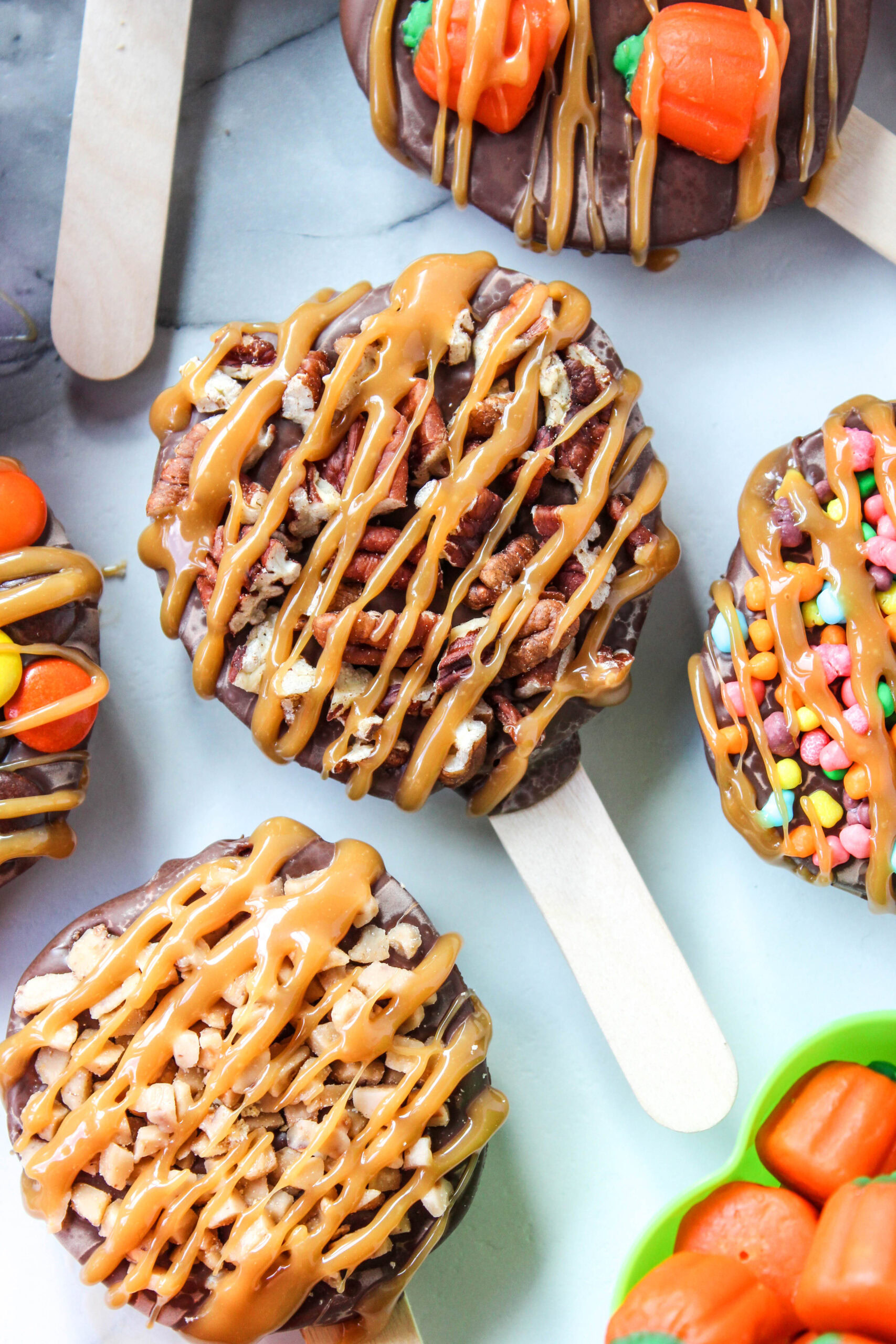 Chocolate caramel candied apple pops dipped in rich milk chocolate