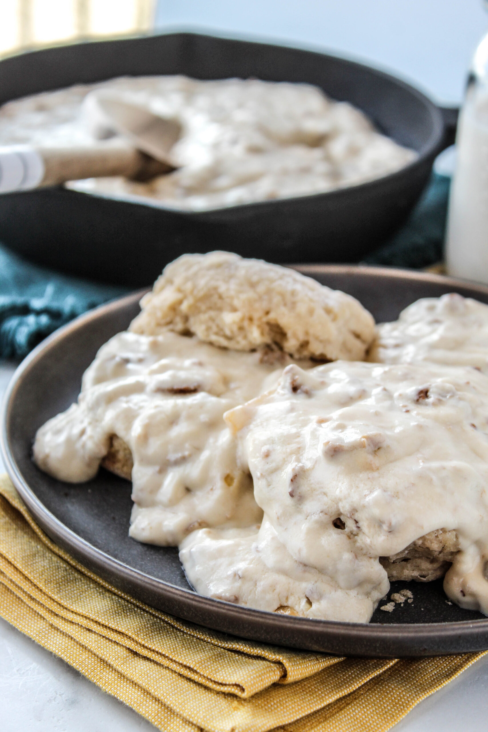 Vegetarian biscuits topped with creamy gravy on a plate