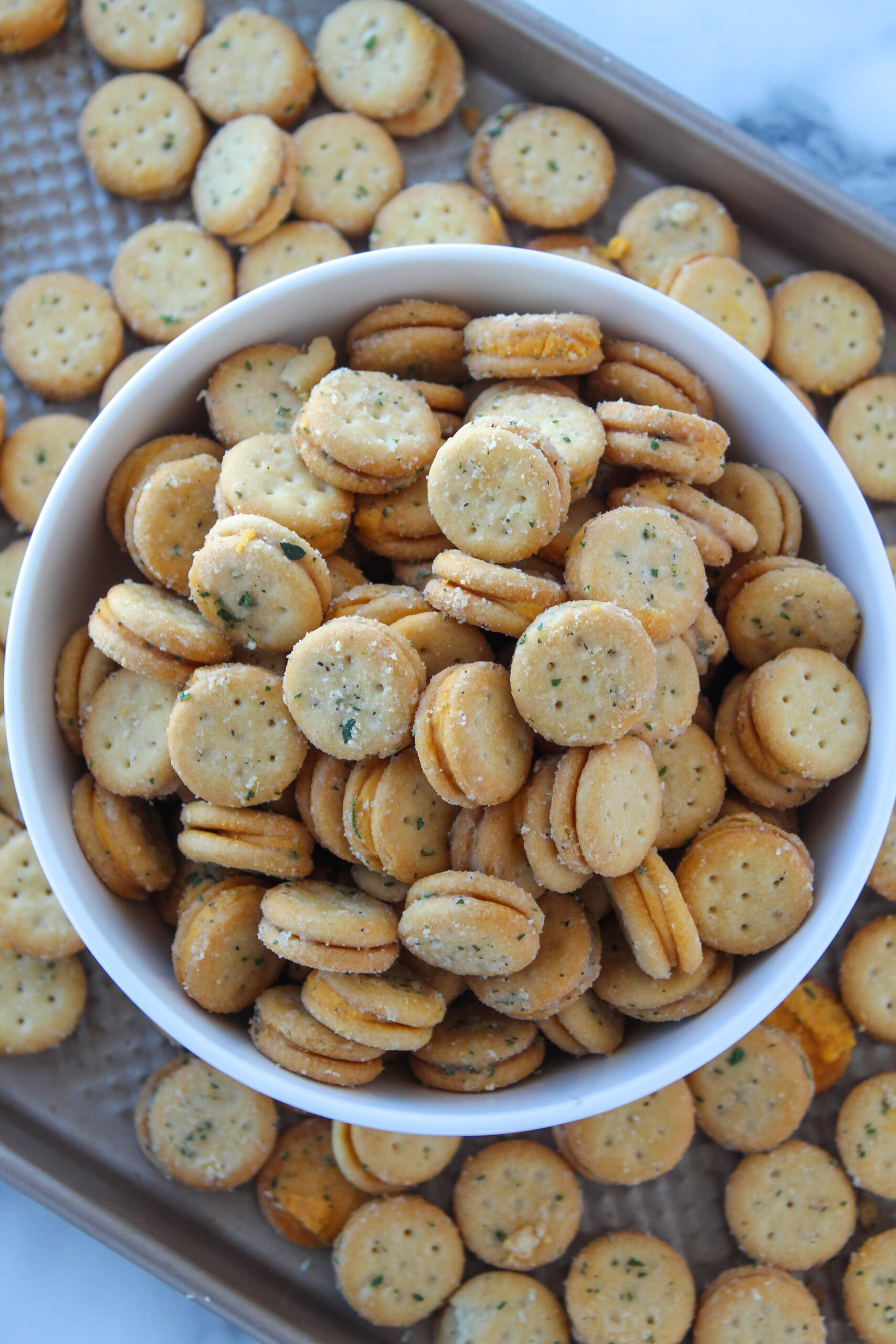 Cheesy ranch crackers served in a small white bowl