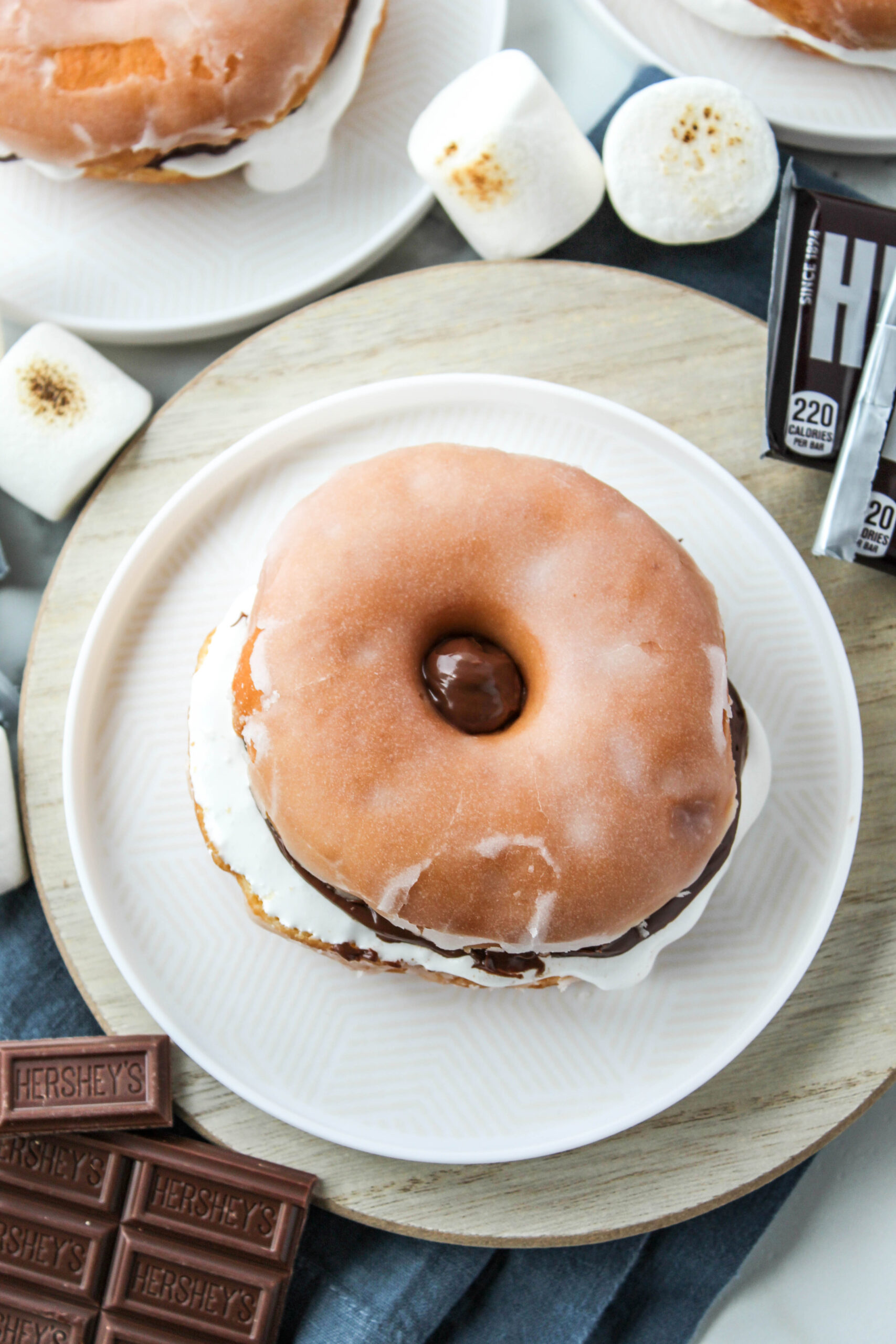 Glazed donut s’mores sandwich with chocolate spread and marshmallow fluff