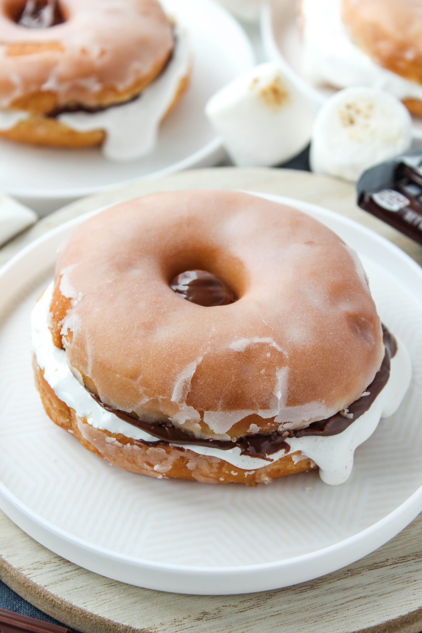 Close-up of donut s’mores dessert with gooey Nutella and fluffy marshmallow creme filling