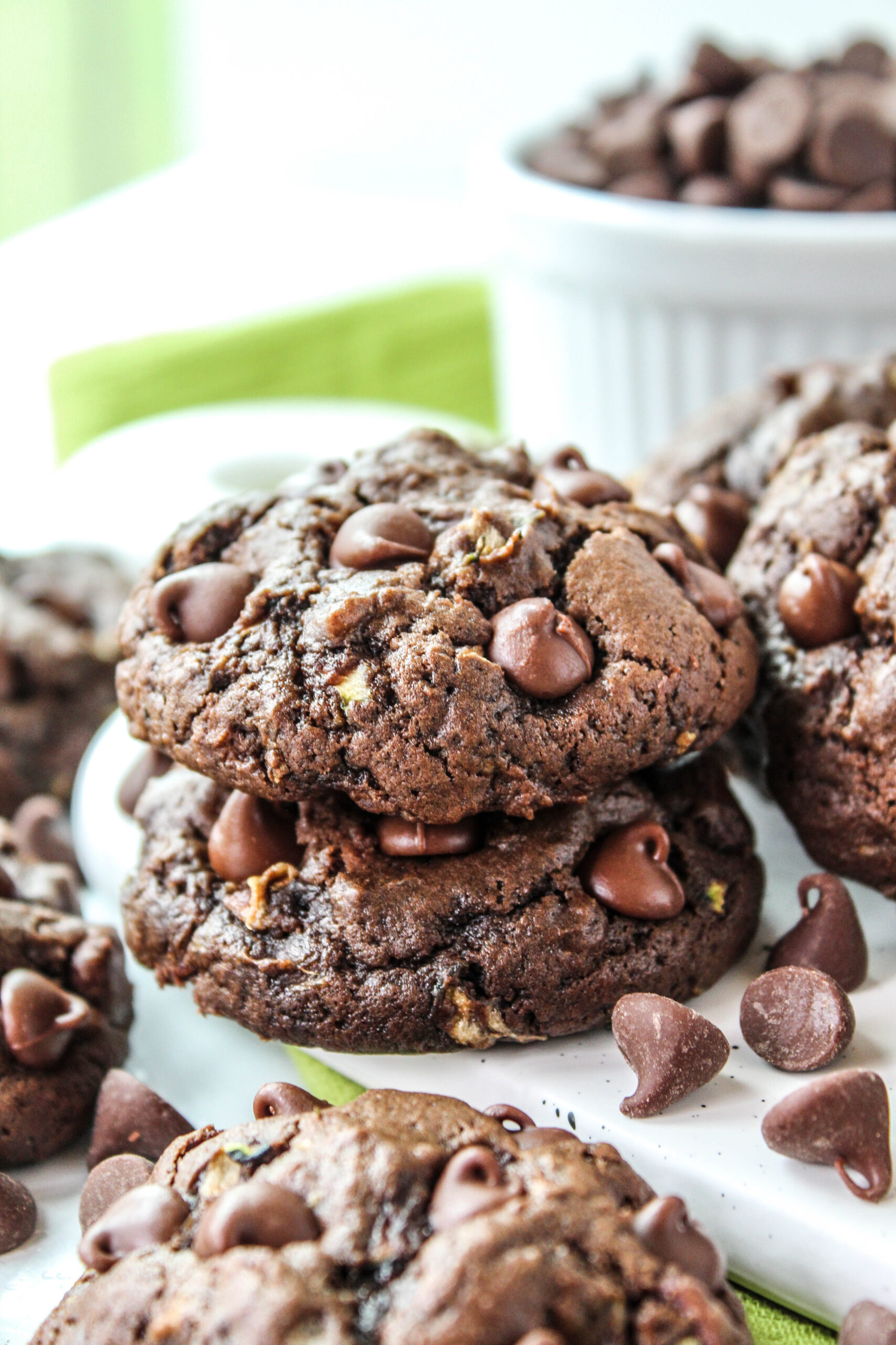 Homemade chocolate zucchini cookies stacked on a plate