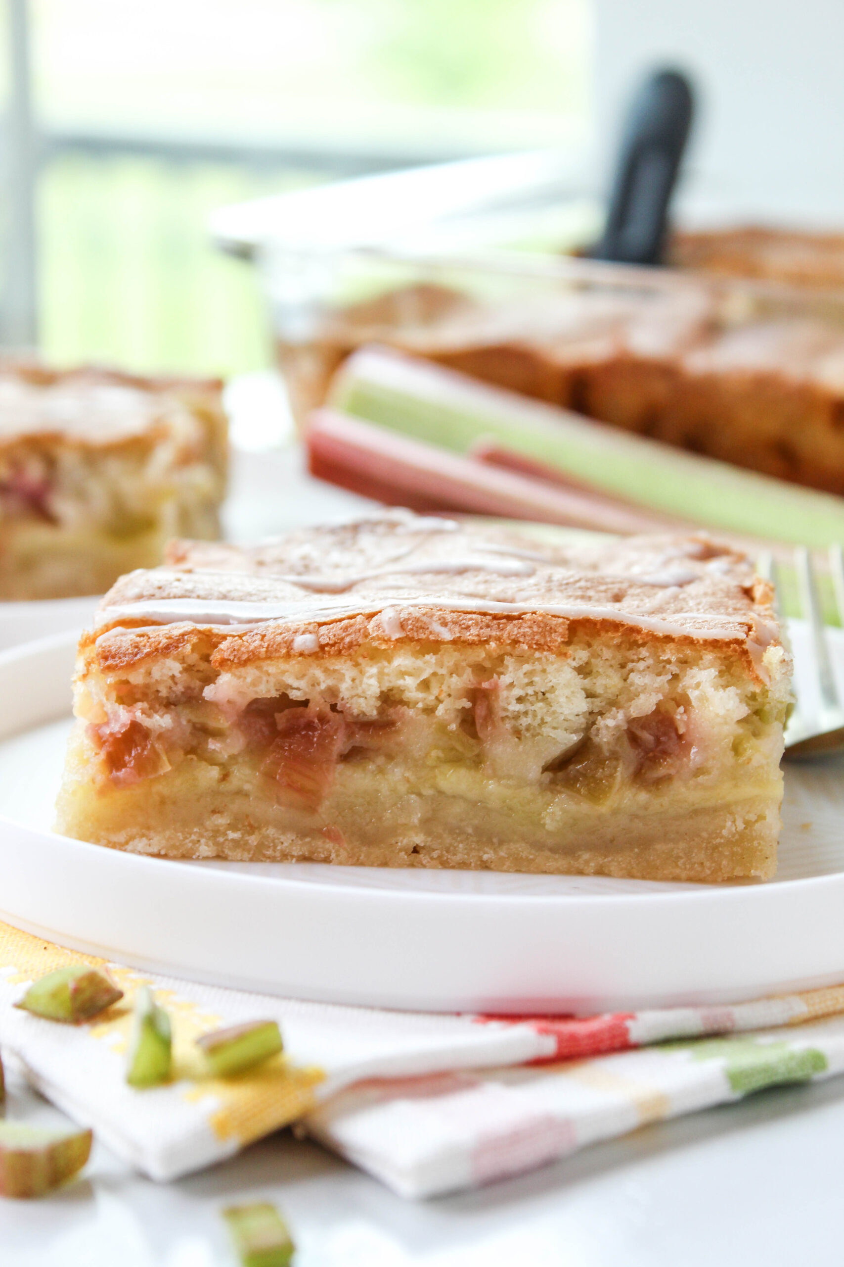 Layered rhubarb dream bars with shortbread base and custard‑style filling