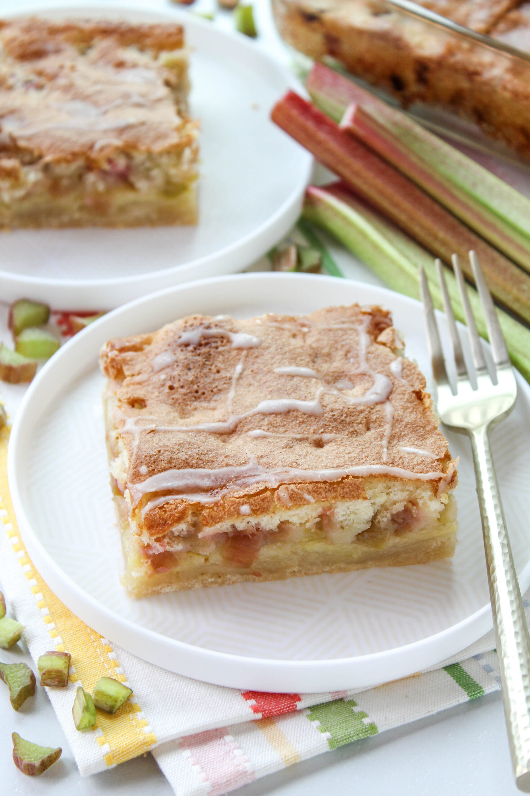 Rhubarb dream bars with buttery shortbread crust and creamy custard filling