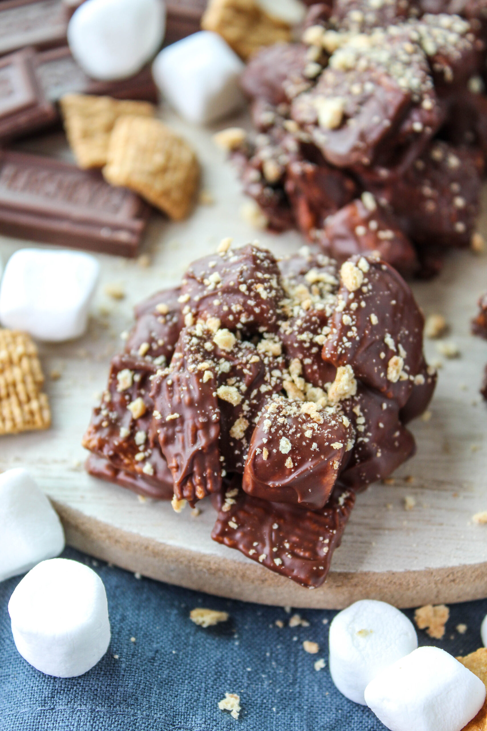 S’mores candy bites made with melted chocolate, mini marshmallows, and graham cereal