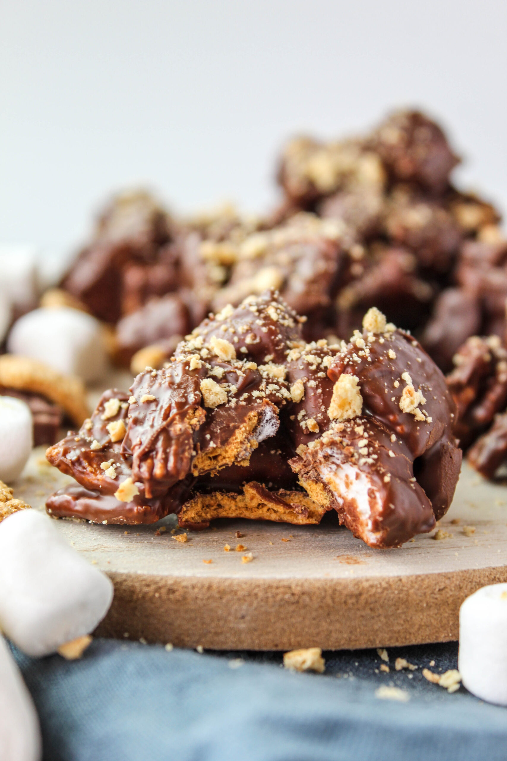 Close‑up of s’mores candy bites showing chocolate, marshmallows, and graham cereal pieces