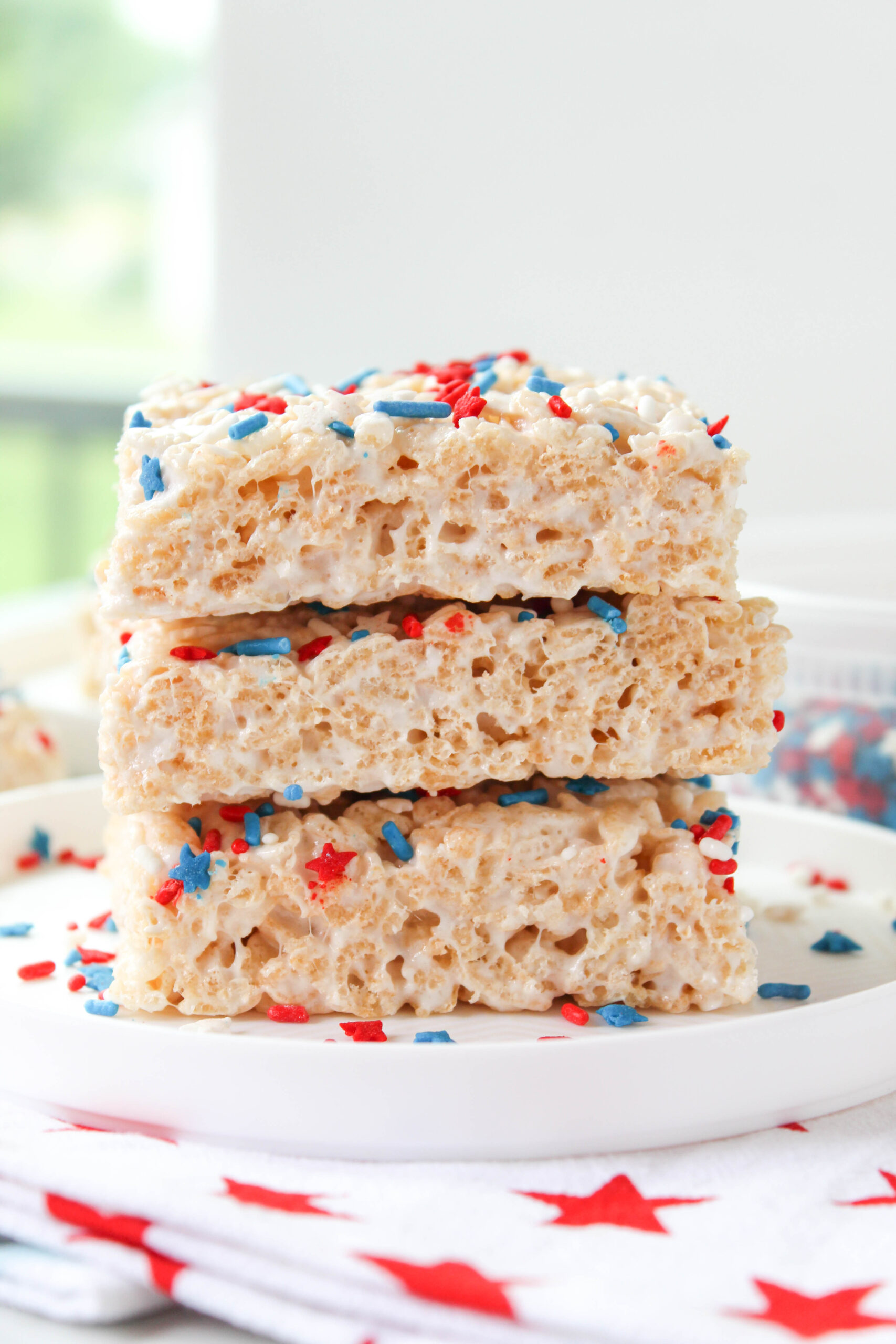 square rice krispie treats decorated with patriotic sprinkles