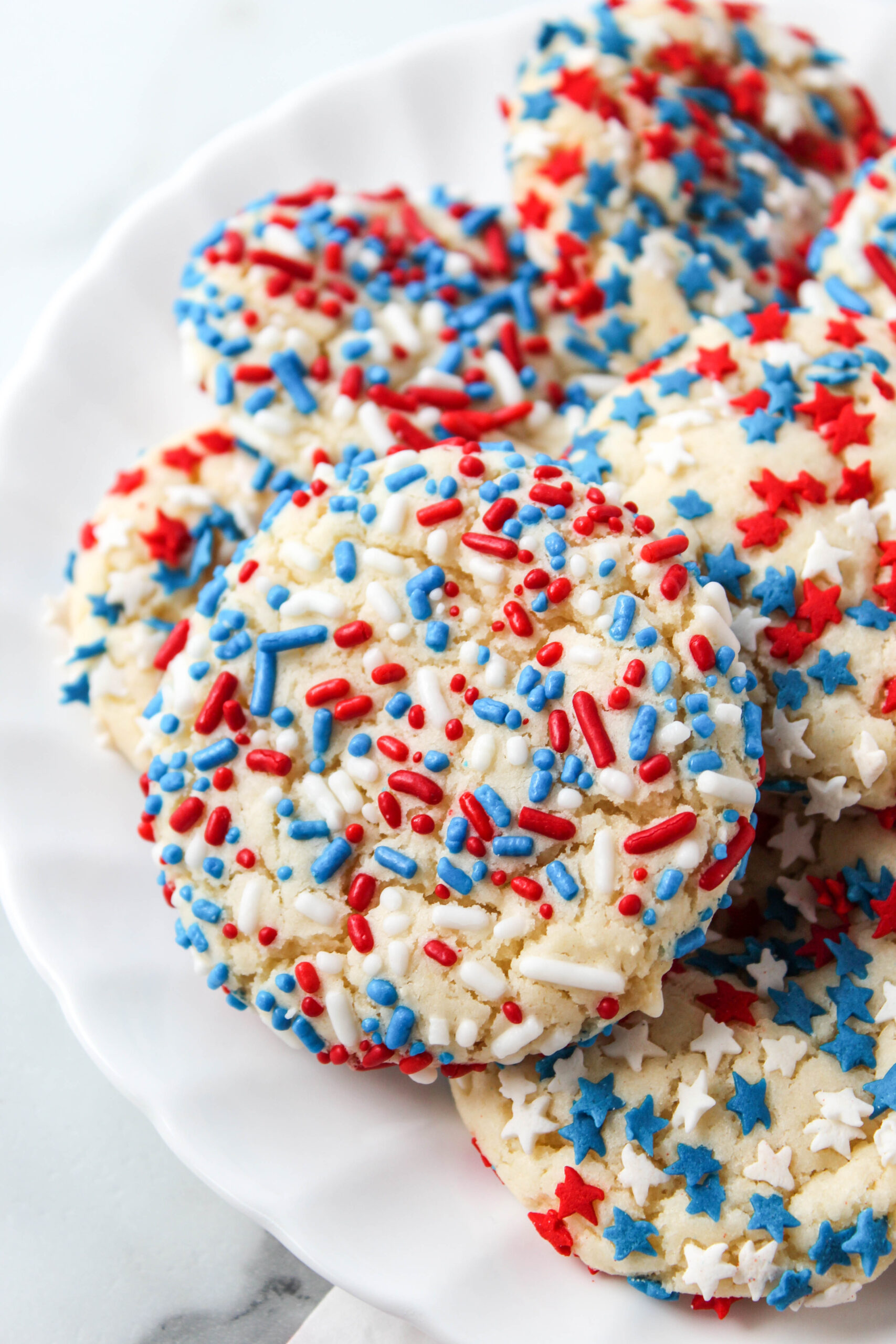 Soft cake mix cookies decorated with red white and blue sprinkles for the 4th of July