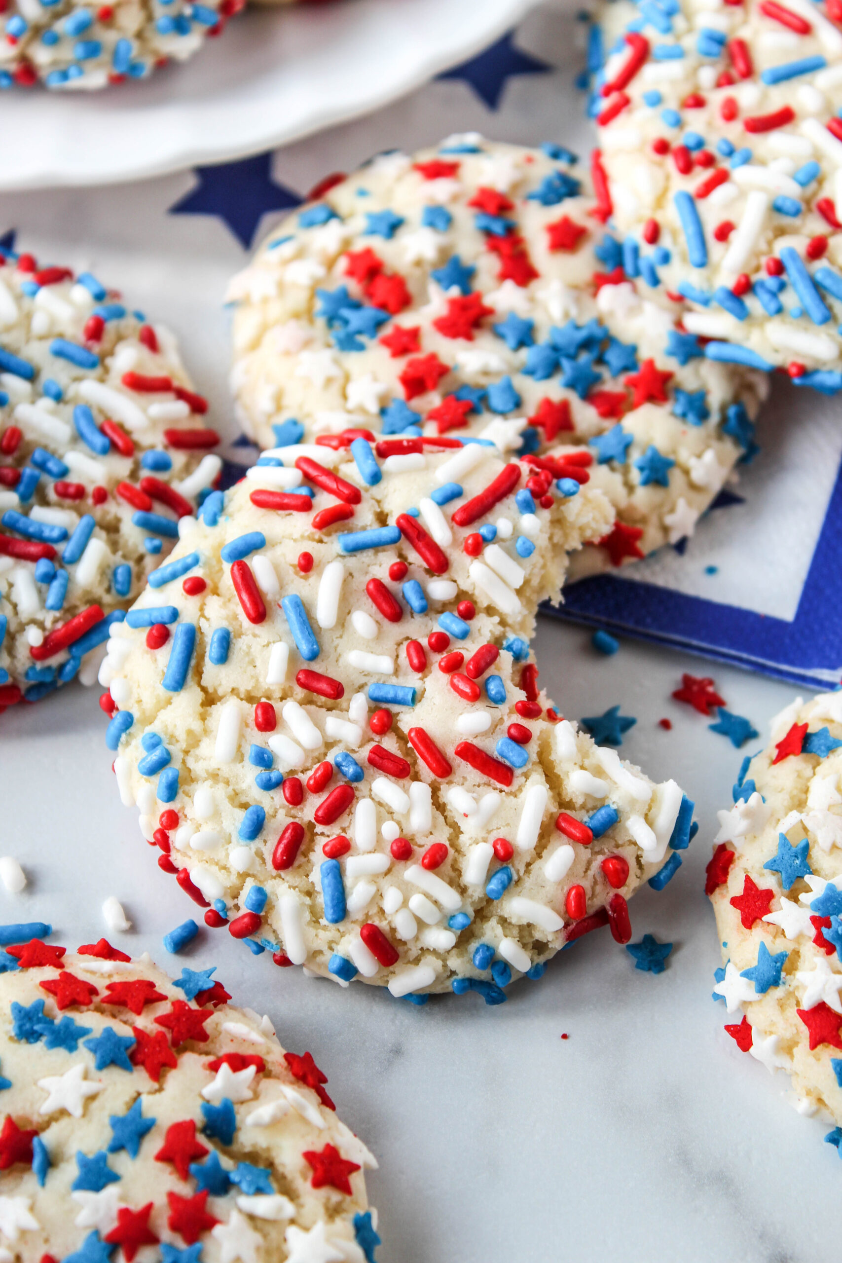 Easy 4th of July cake mix cookies, soft and chewy, loaded with red white and blue sprinkles for a festive dessert