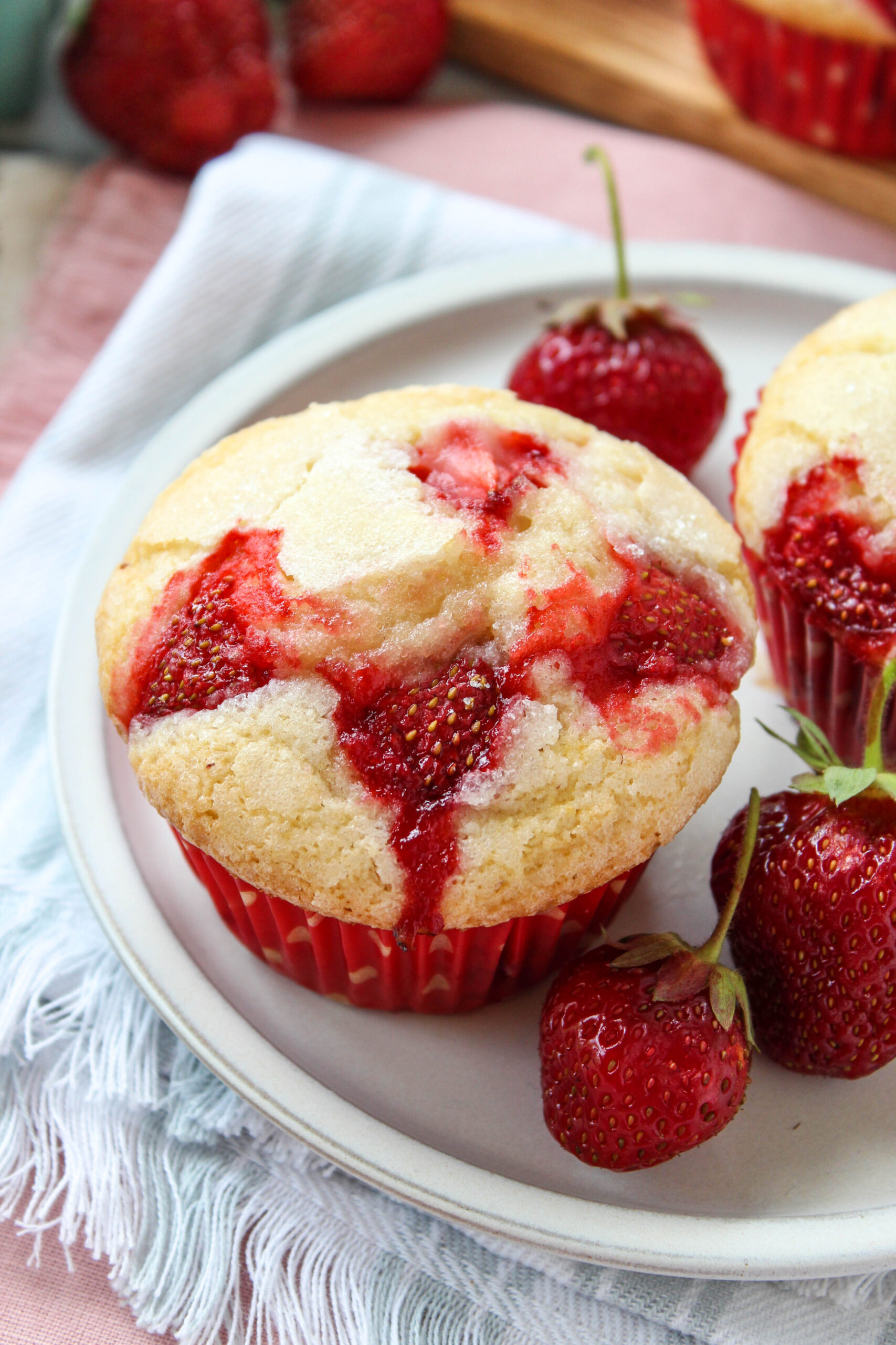 Freshly baked strawberry muffins with golden tops