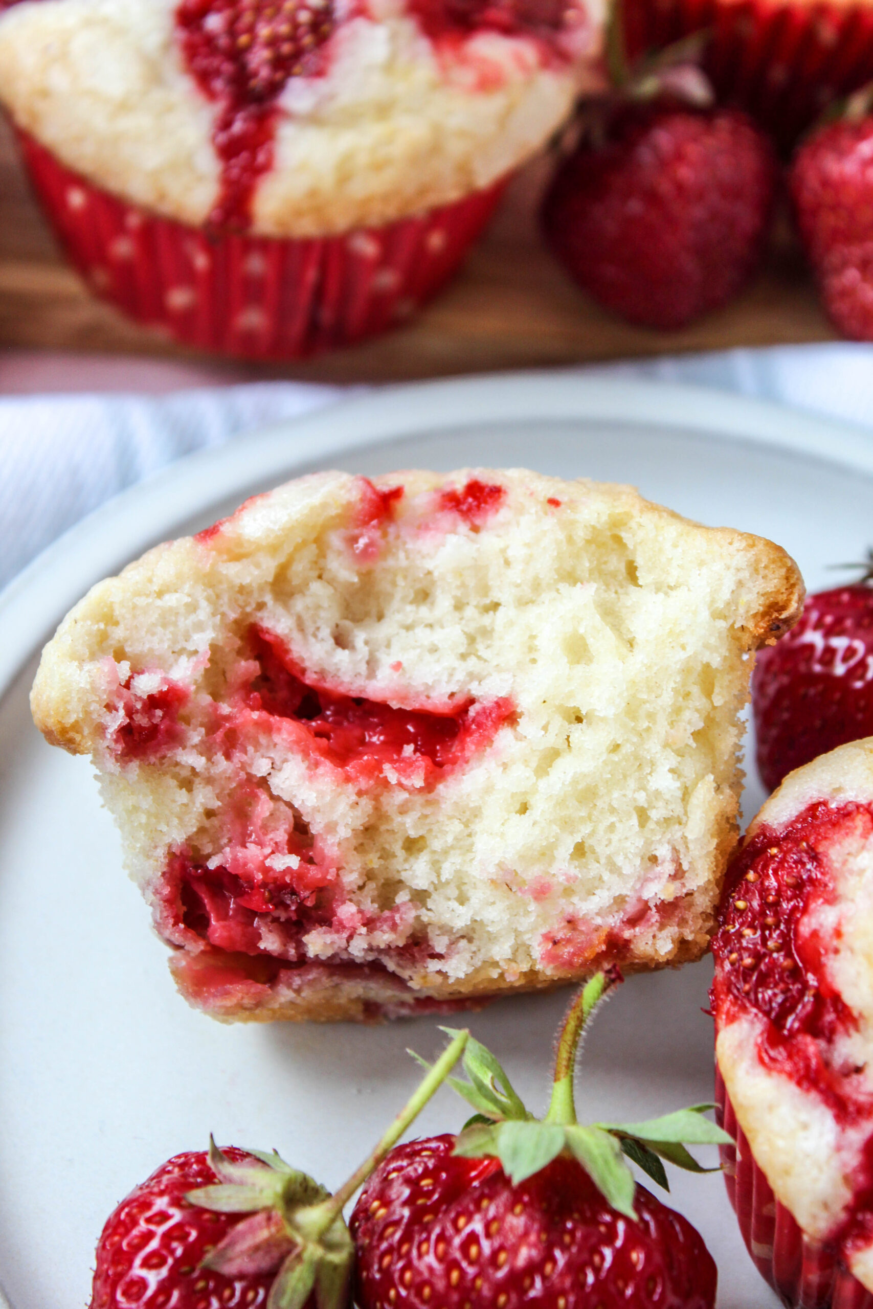 Close‑up of soft strawberry muffins showing tender crumb and berries