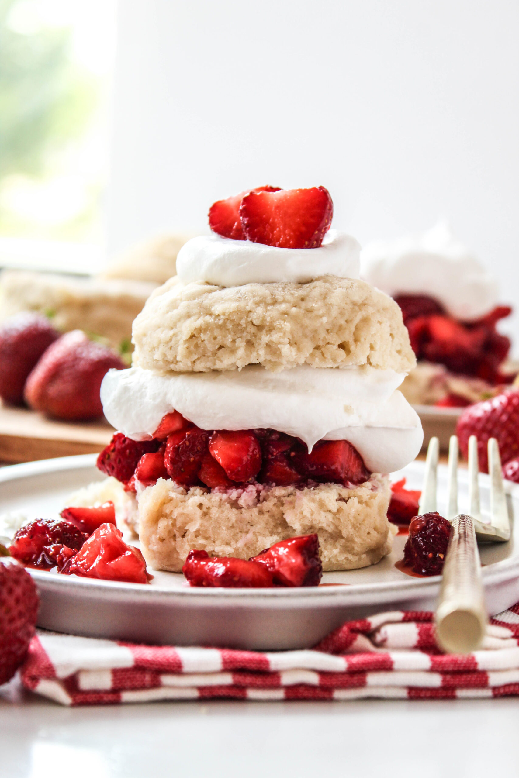 Strawberry shortcake served with fresh strawberries on top