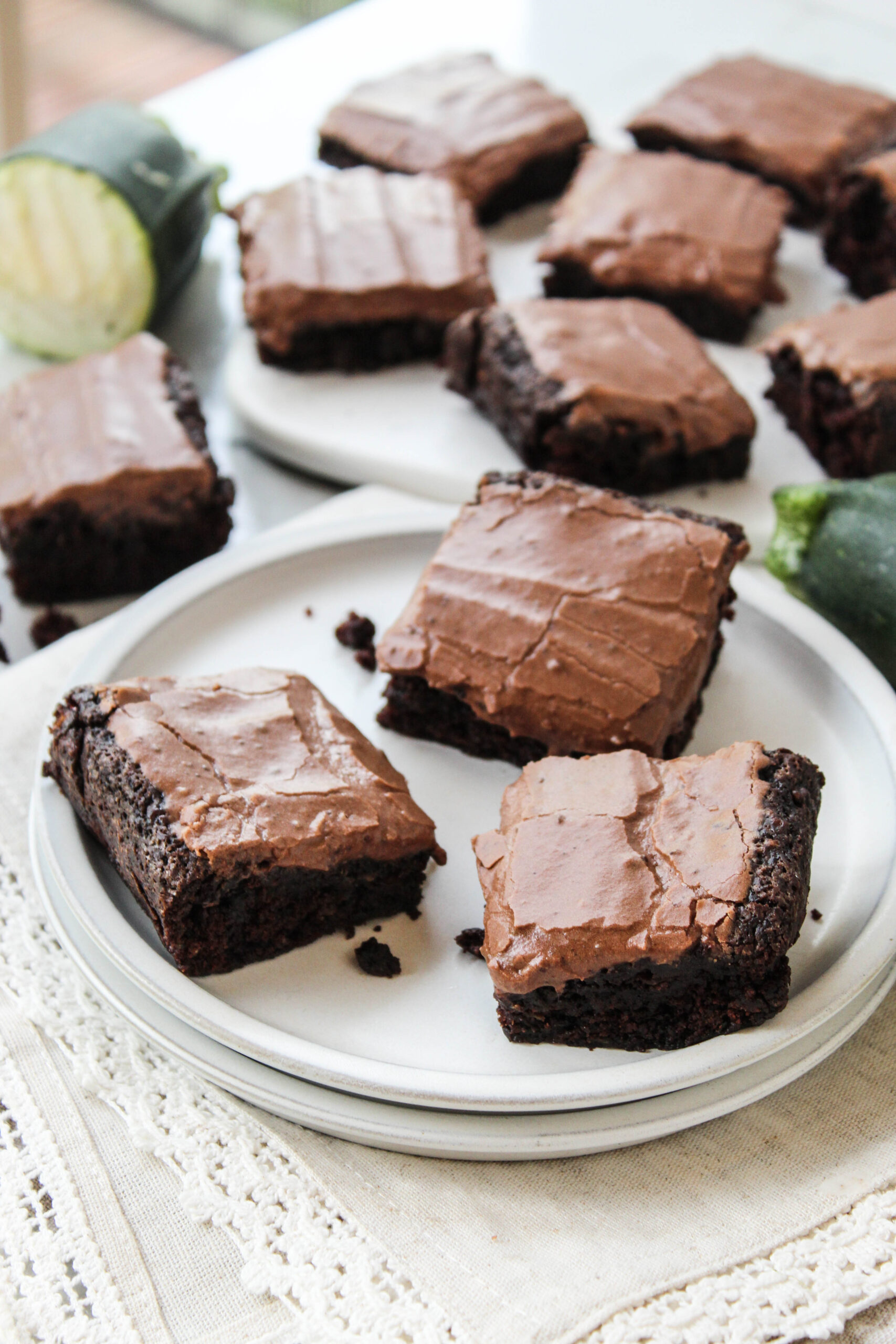Homemade zucchini brownies sliced into squares with a rich chocolate finish