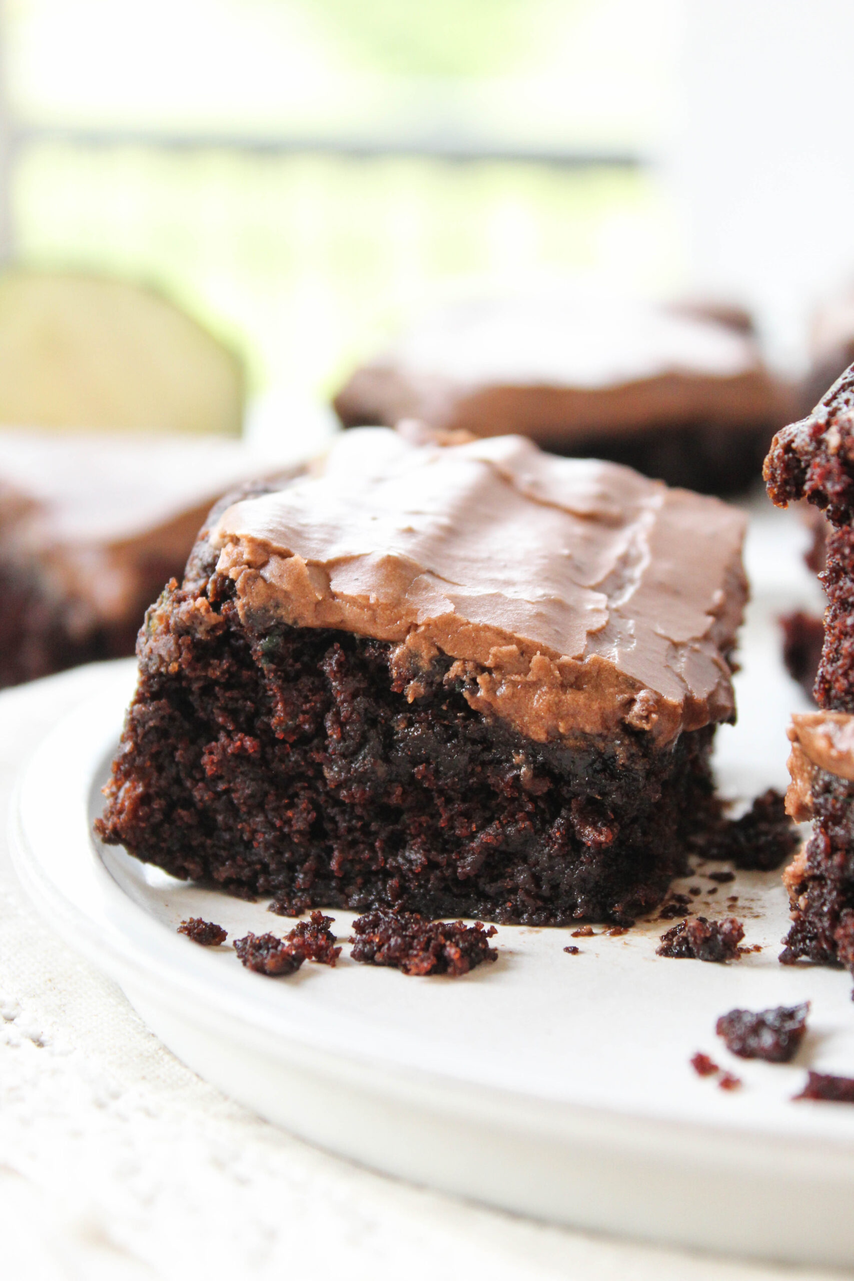 Moist zucchini brownies with a glossy chocolate top and soft bite