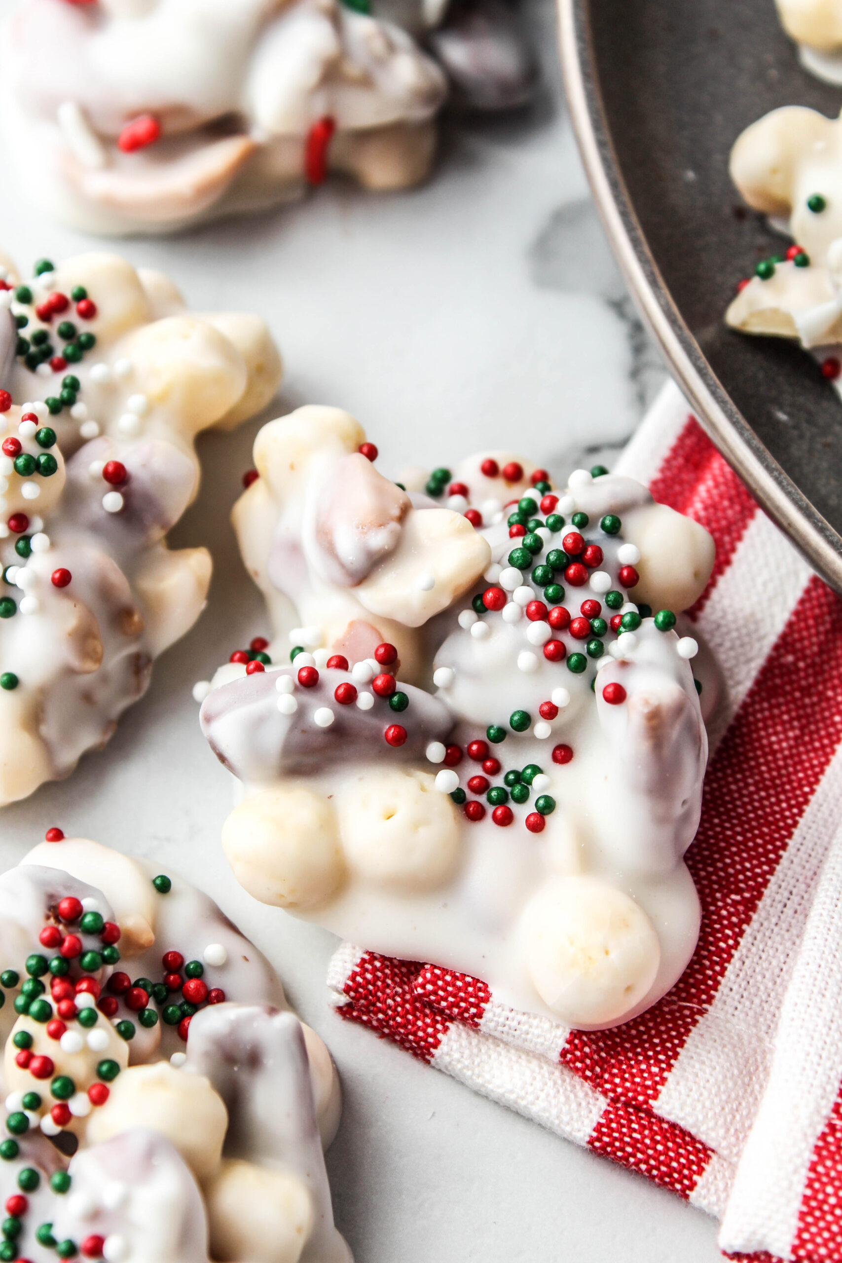 Almond bark clusters arranged neatly for holiday gifting