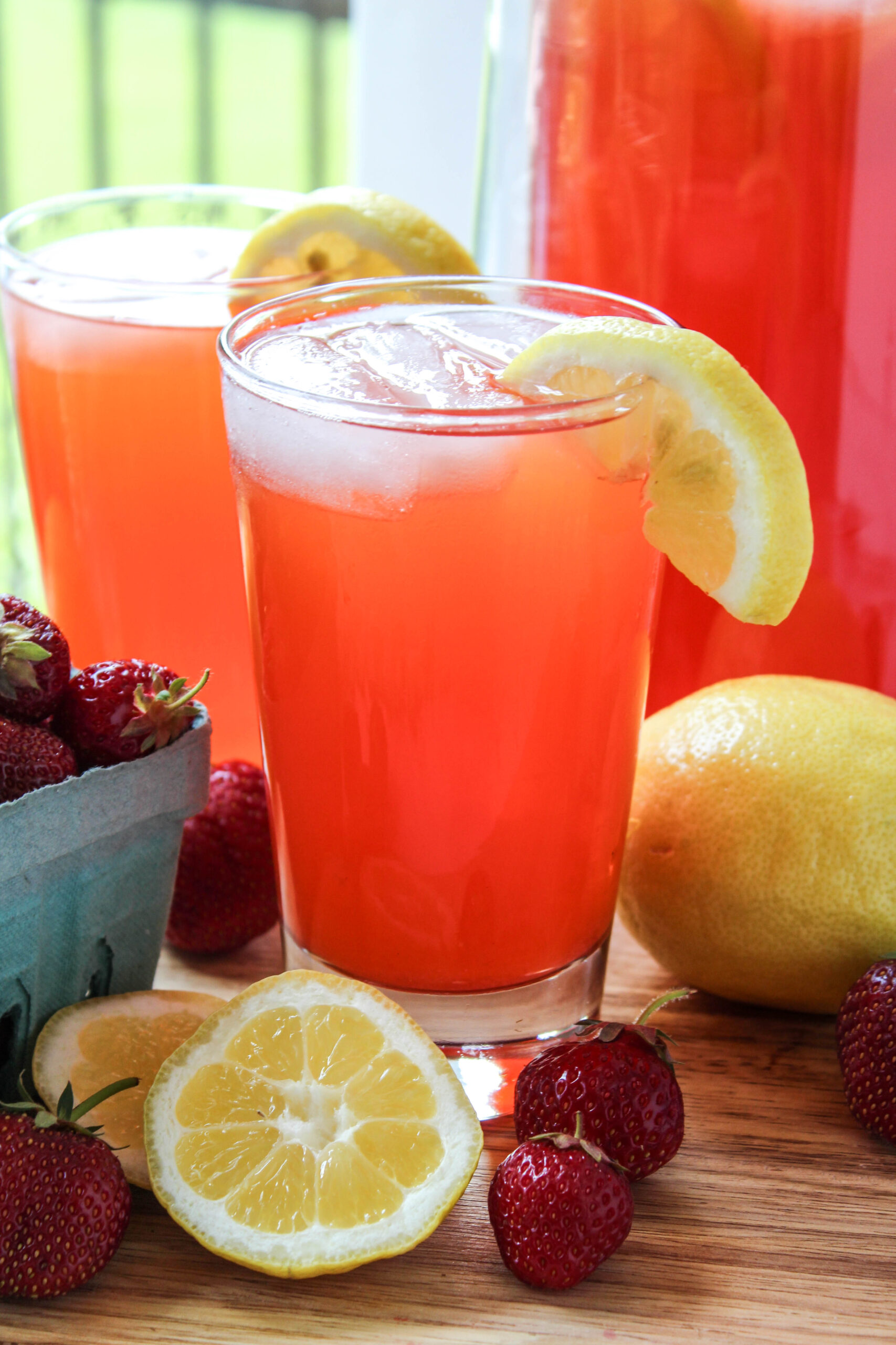 glass of strawberry lemonade garnished with fresh strawberries