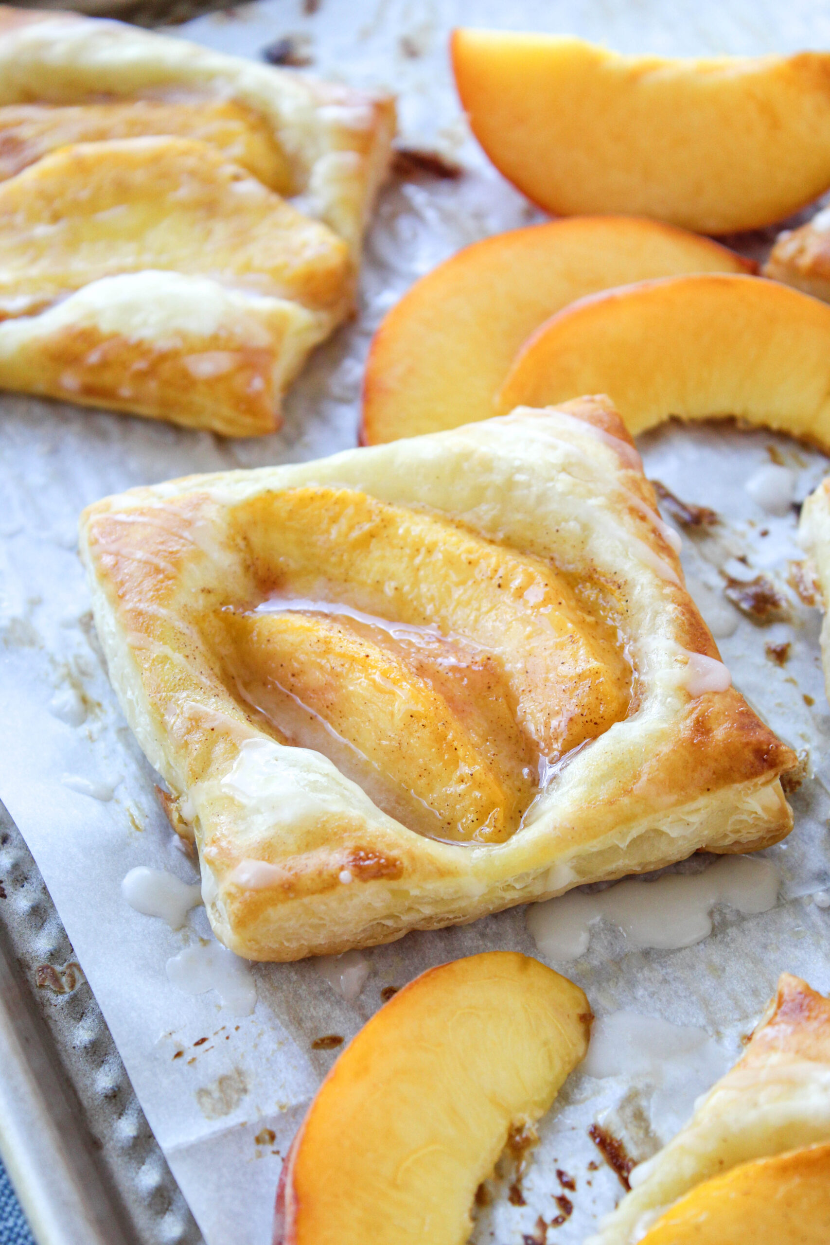 Golden peach puff pastry tarts with caramelized peaches