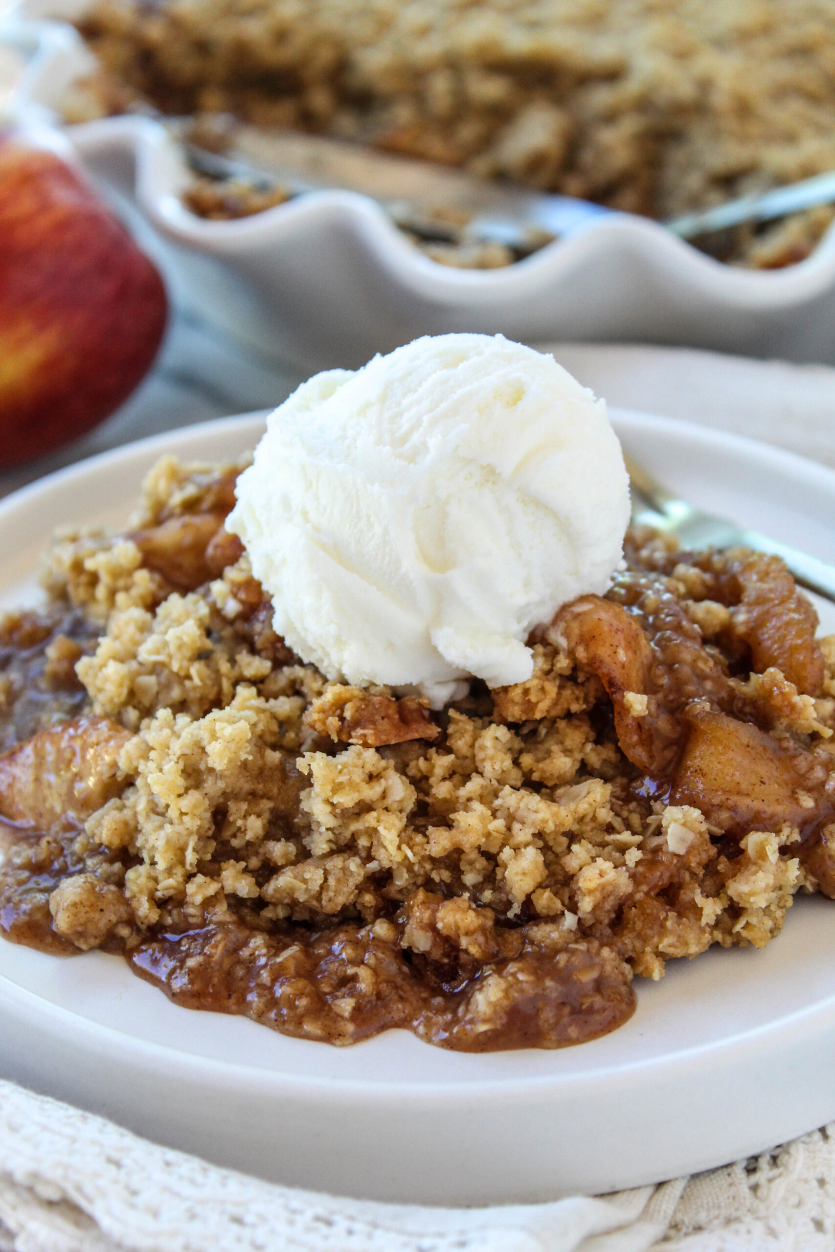 Apple crisp dessert topped with crunchy oats
