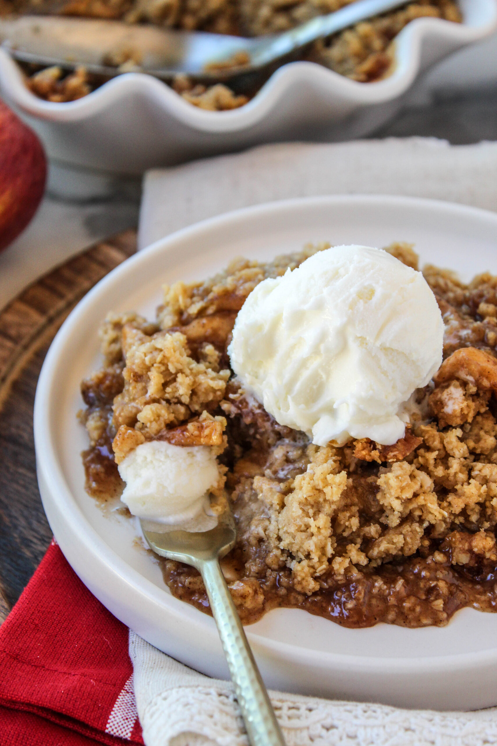 Freshly baked apple crisp with tender cinnamon apples and a buttery oat crumble topping