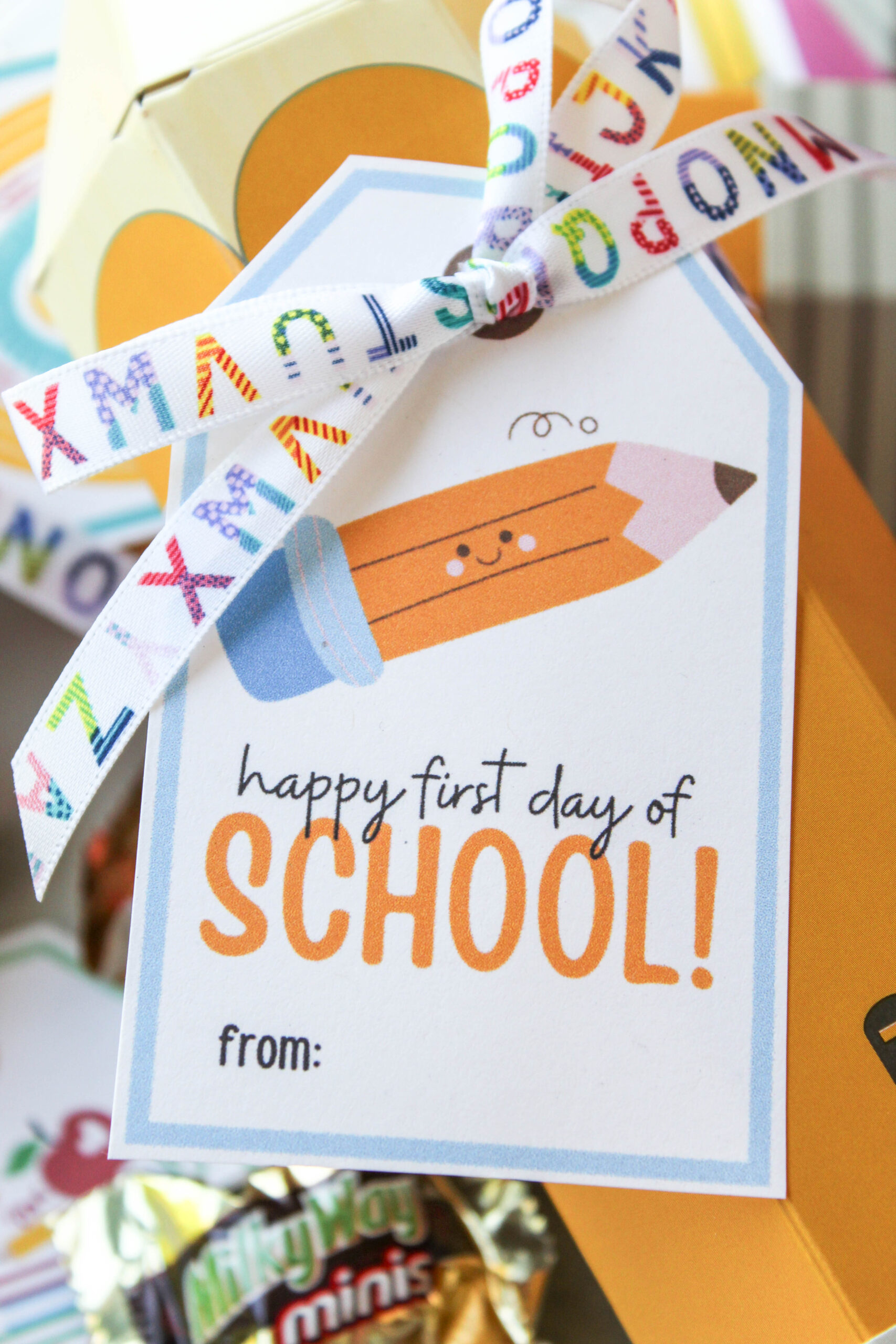 Back-to-school gift tag featuring notebooks, pencils, and a welcoming school theme