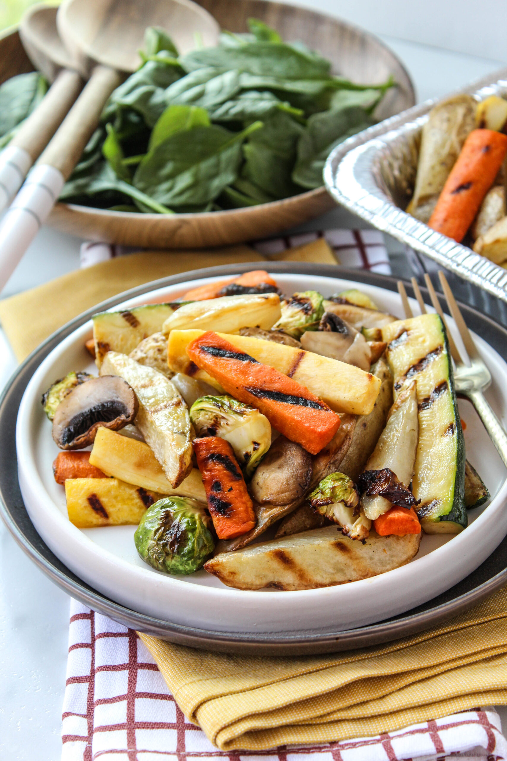 Seasoned air fryer vegetables on a plate with a warm, roasted finish