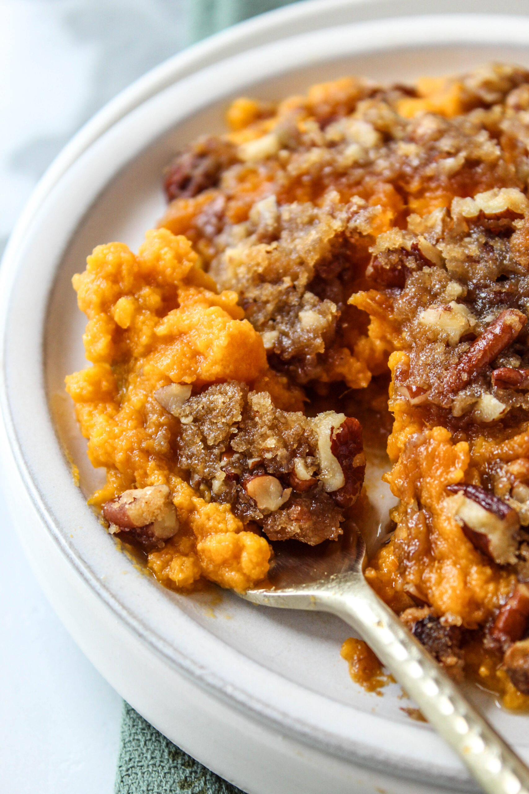 Sweet potato casserole with crisp pecan praline topping fresh from the oven