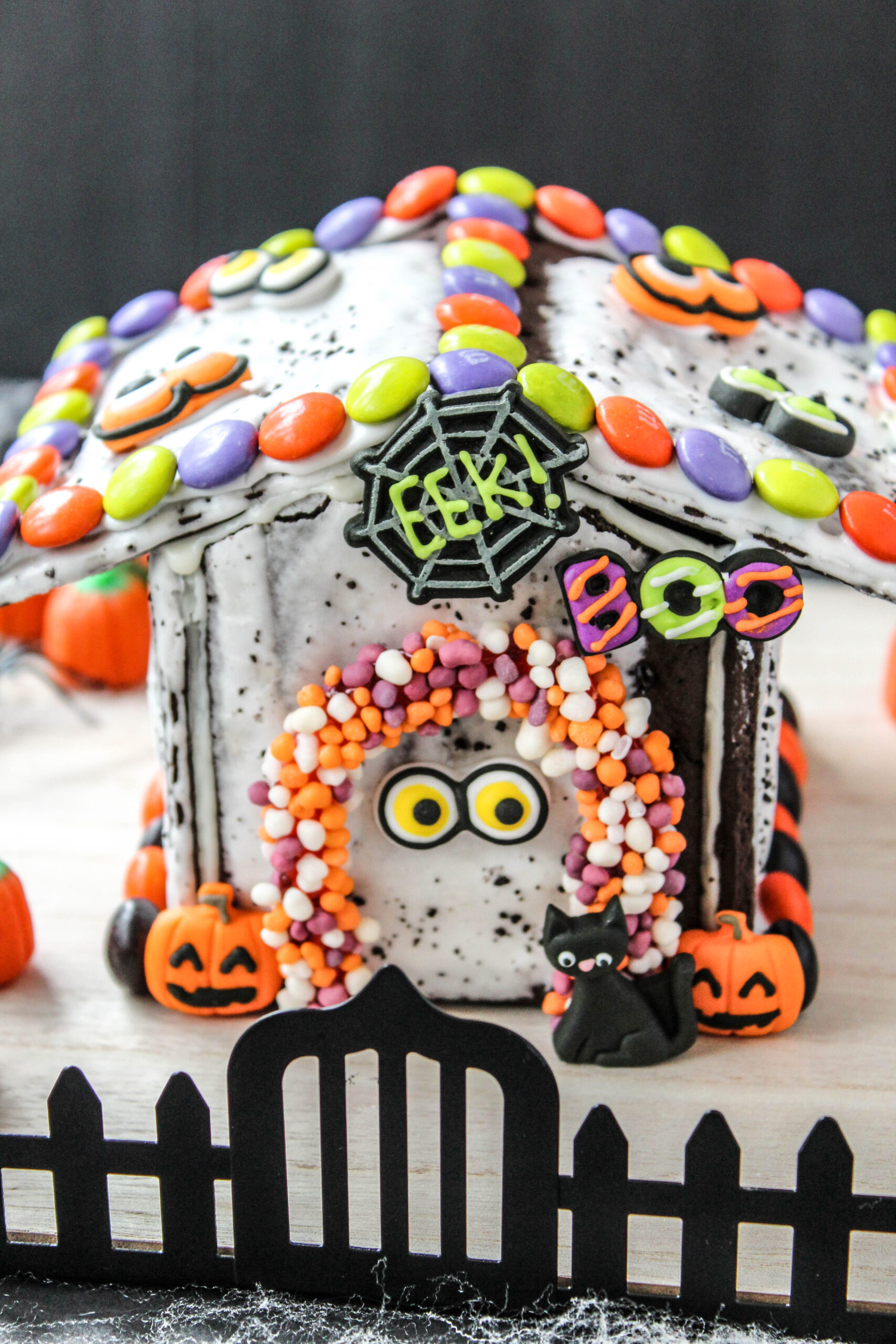 Spooky Halloween dessert featuring a decorated Pop-Tart haunted house