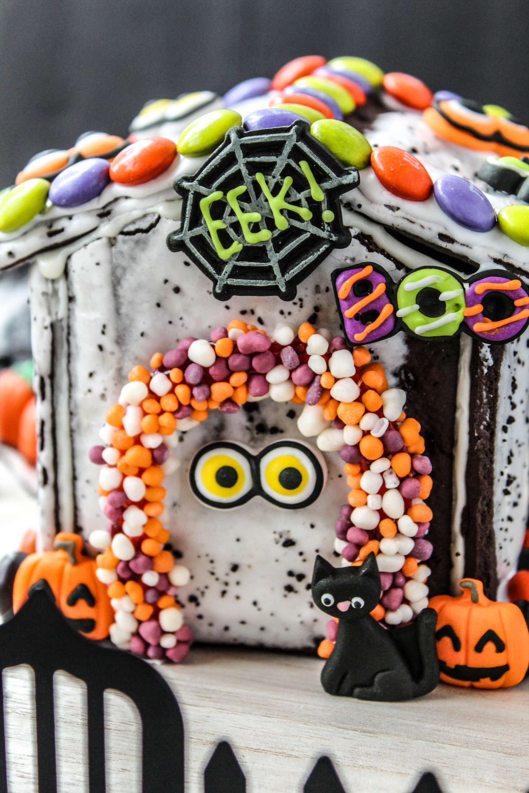 Halloween Pop-Tart haunted house decorated with colorful candy and icing