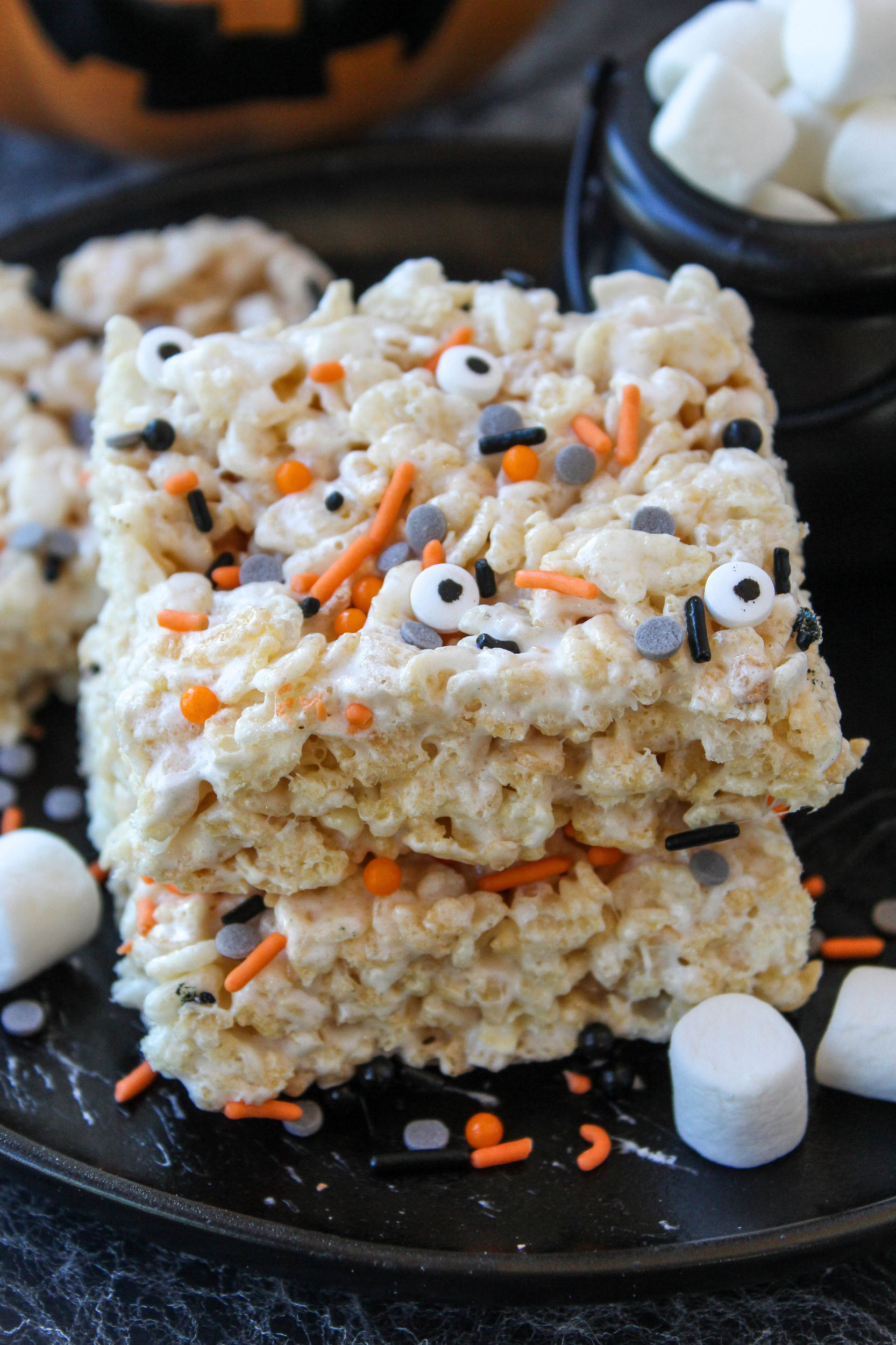 Rice Krispie treat decorated with candy eyes for Halloween