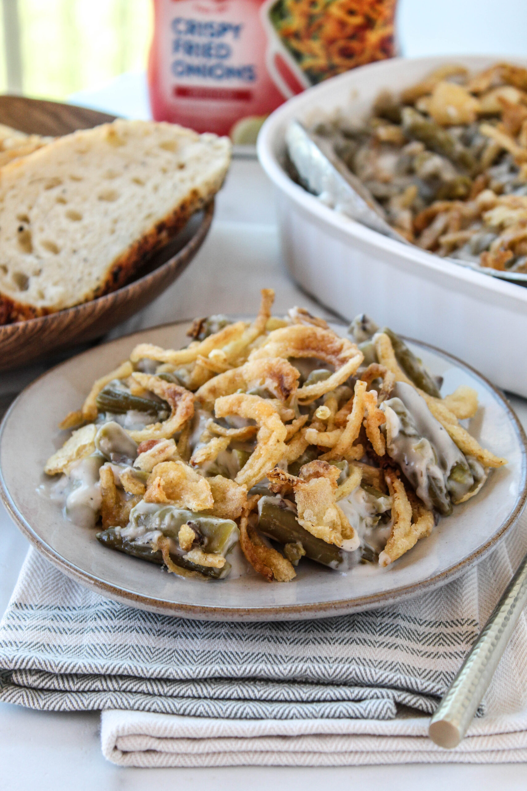 Close up of classic green bean casserole with crispy fried onions on top