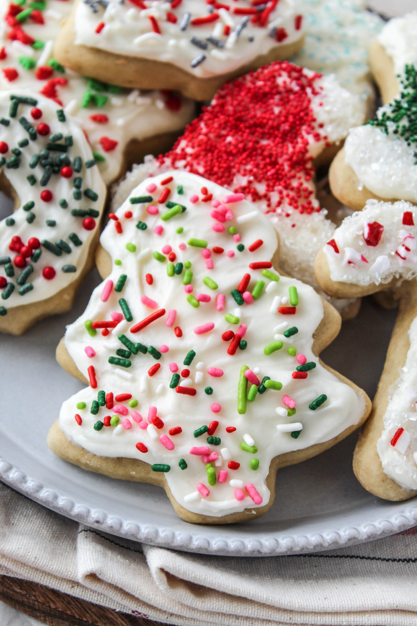 Cutout sugar cookies with soft texture and detailed Christmas icing designs