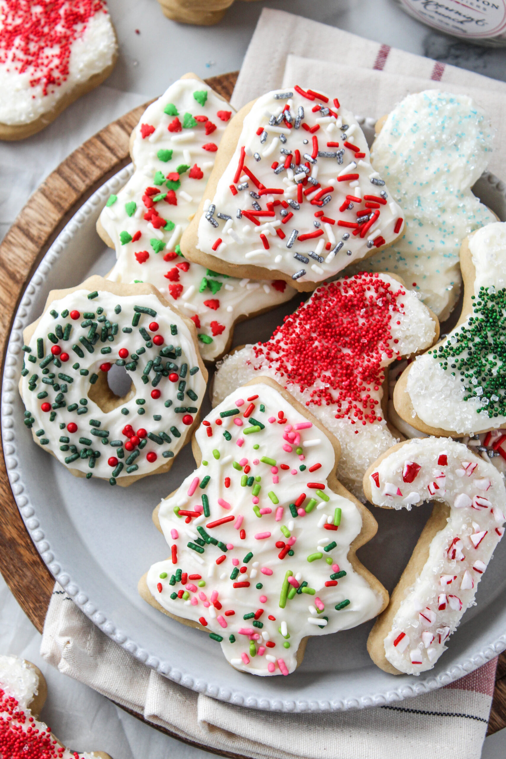 Close‑up of soft Christmas cutout cookies showing fluffy texture and smooth icing