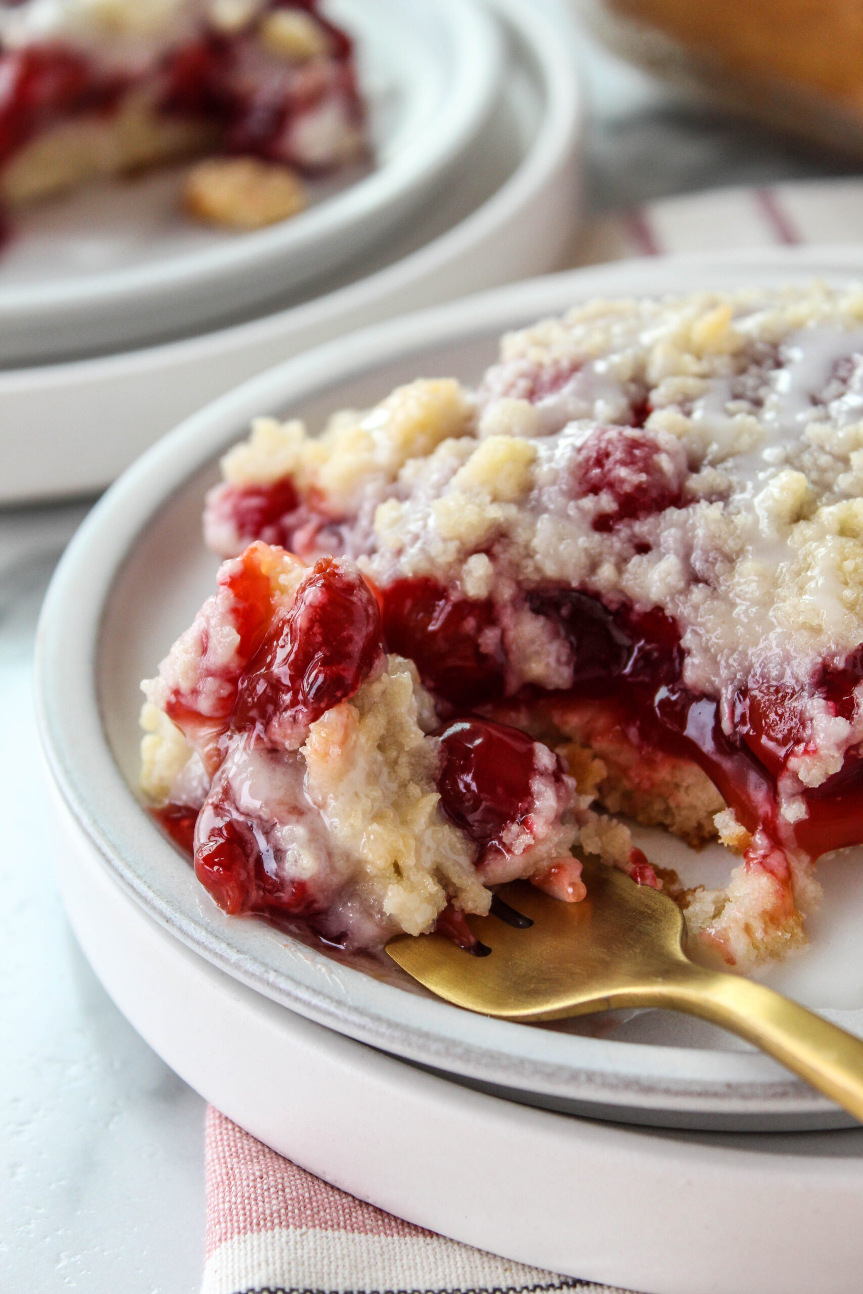 Close-up of moist cherry coffee cake with layers of sweet cherries