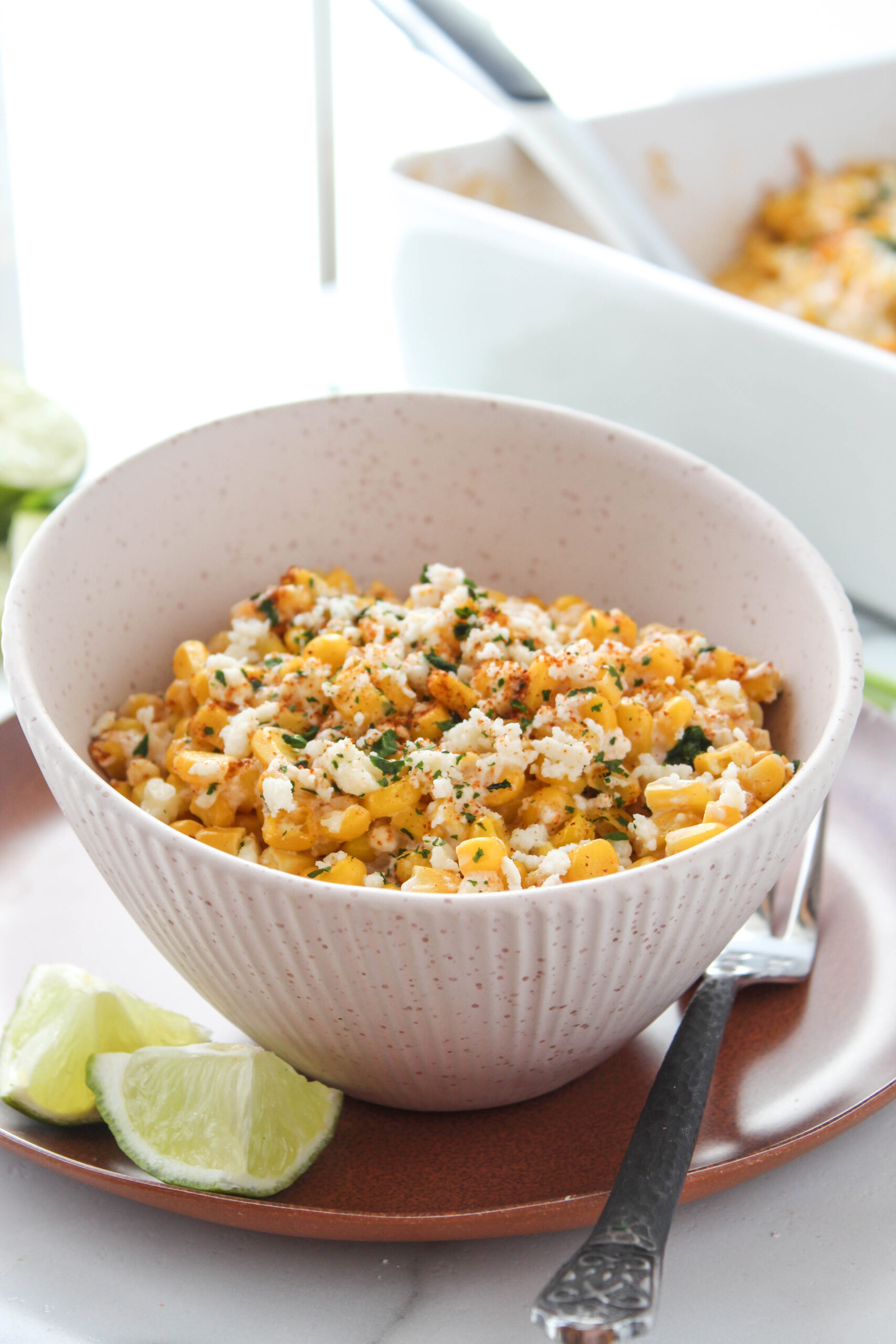 Serving of baked street corn casserole on a plate