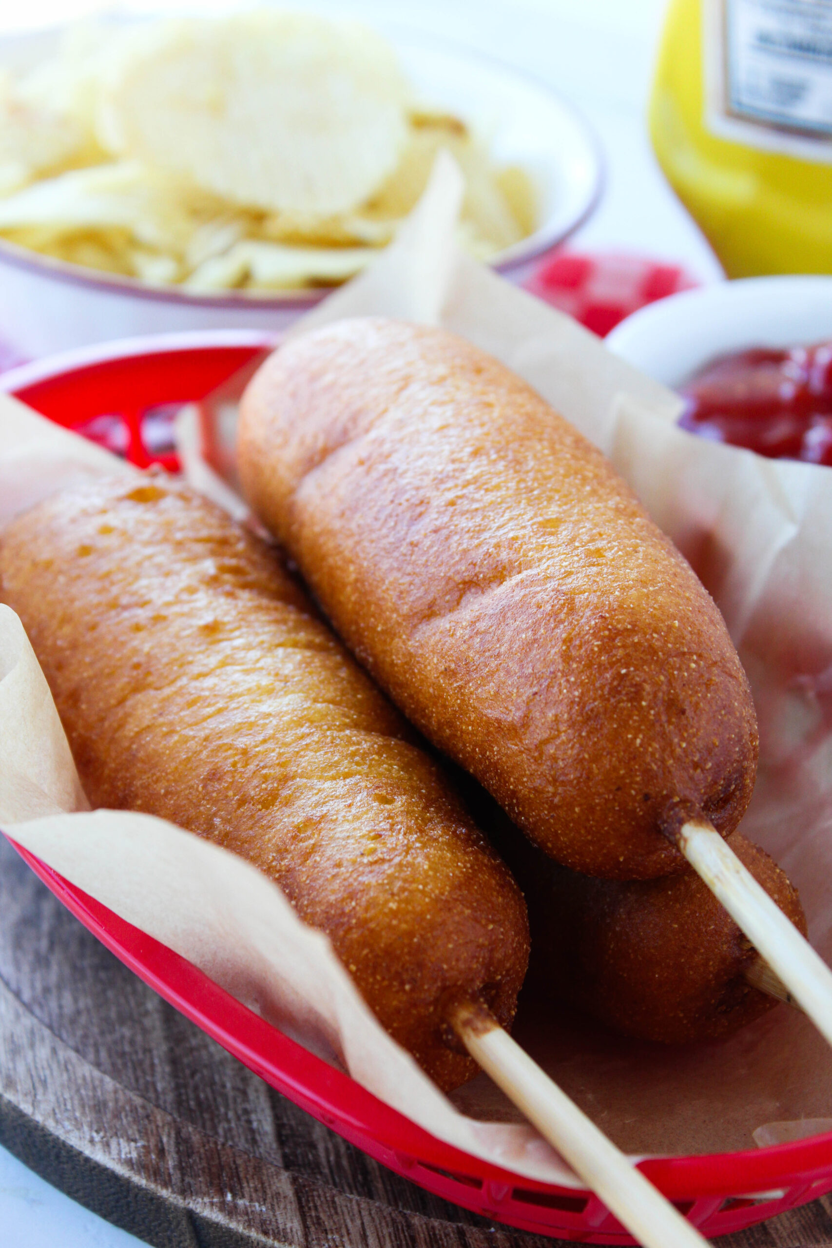 Freshly fried vegetarian corn dogs served with mustard and ketchup