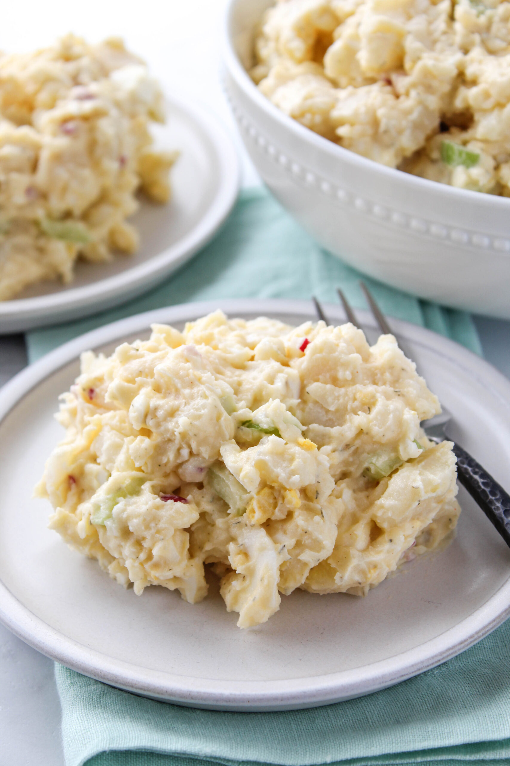 Classic potato salad made with potatoes, eggs, celery, and creamy mayonnaise dressing