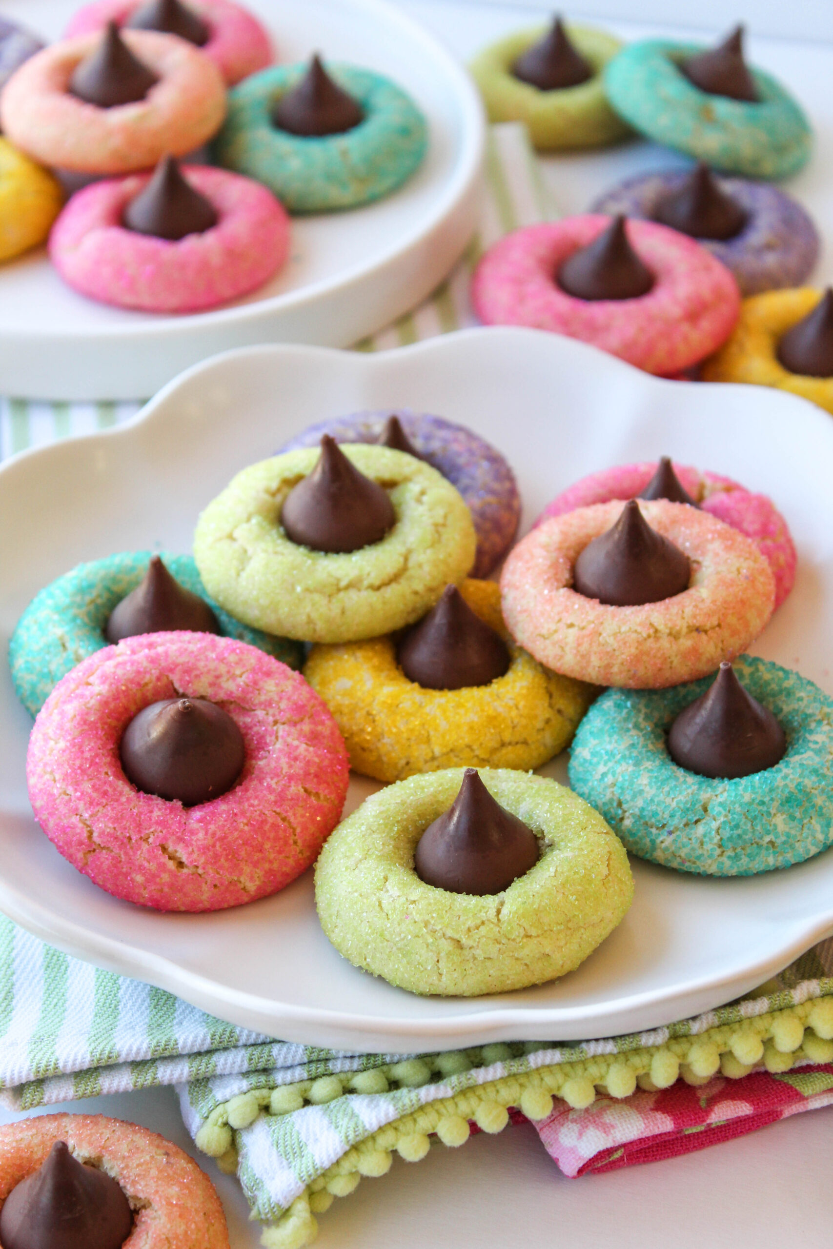 Plate of spring blossom cookies with chocolate candy tops